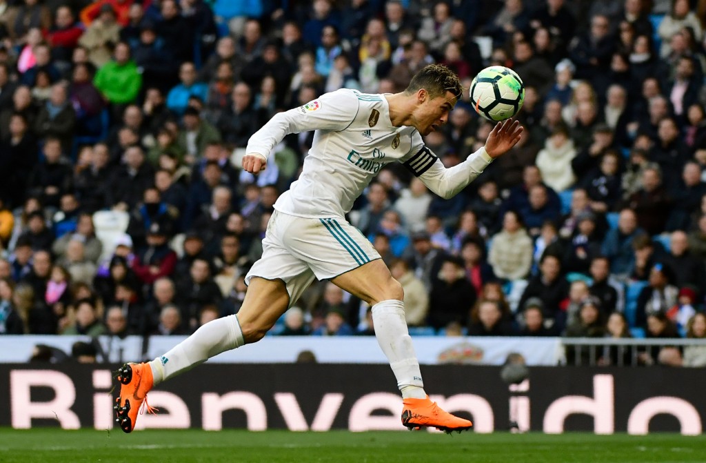 Real Madrid's Portuguese forward Cristiano Ronaldo heads the ball during the Spanish league football match between Real Madrid CF and Deportivo Alaves at the Santiago Bernabeu stadium in Madrid on February 24, 2018. / AFP PHOTO / PIERRE-PHILIPPE MARCOU (Photo credit should read PIERRE-PHILIPPE MARCOU/AFP/Getty Images)