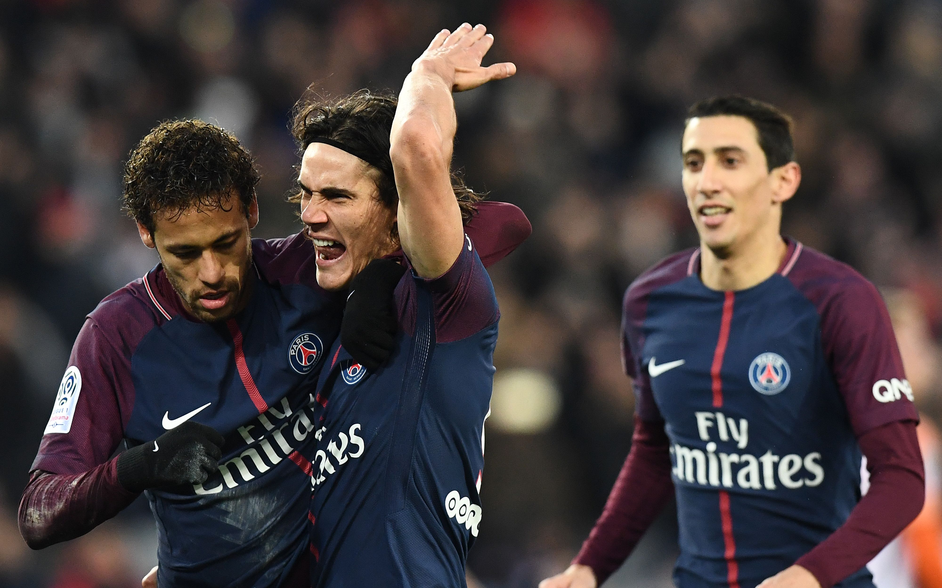 Paris Saint-Germain's Brazilian forward Neymar (L) celebrates with Paris Saint-Germain's Uruguayan forward Edinson Cavani after scoring a penalty kick during the French L1 football match between Paris Saint-Germain (PSG) and Montpellier (MHSC) at the Parc des Princes stadium in Paris on January 27, 2018. / AFP PHOTO / FRANCK FIFE (Photo credit should read FRANCK FIFE/AFP/Getty Images)