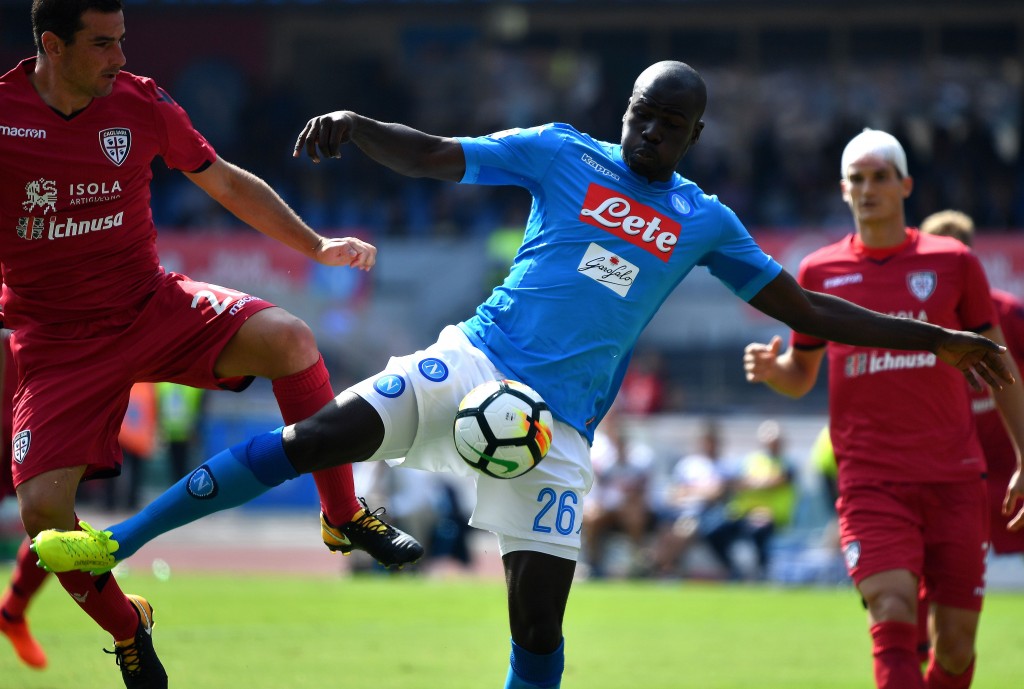 Napoli's French Senegalese defender Kalidou Koulibaly scores during the Italian Serie A football match Napoli vs Cagliari on October 1, 2017 at San Paolo stadium in Naples. / AFP PHOTO / ALBERTO PIZZOLI (Photo credit should read ALBERTO PIZZOLI/AFP/Getty Images)