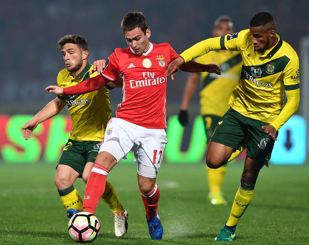 Benfica's Serbian forward Andrija Zivkovic (C) vies with Pacos de Ferreira's midfielder Pedrinho (L) and Brazilian defender Bruno Santos during the Portuguese league football match FC Pacos de Ferreira vs SL Benfica at the Capital do Movel stadium in Pacos de Ferreira on March 18, 2017. / AFP PHOTO / FRANCISCO LEONG (Photo credit should read FRANCISCO LEONG/AFP/Getty Images)
