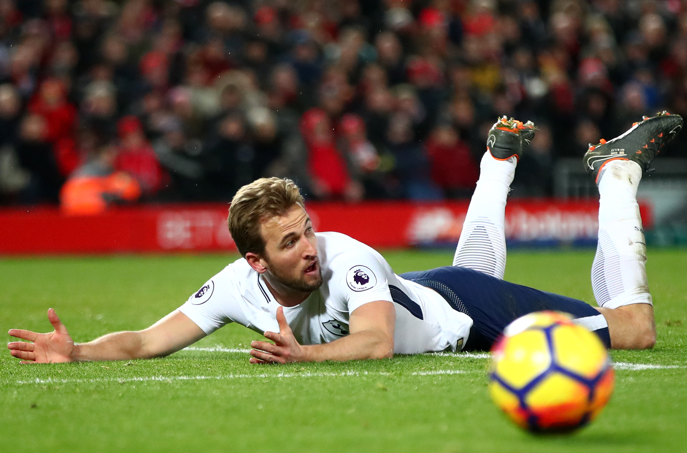 LIVERPOOL, ENGLAND - FEBRUARY 04: Harry Kane of Tottenham Hotspur reacts to being fouled in the penalty area during the Premier League match between Liverpool and Tottenham Hotspur at Anfield on February 4, 2018 in Liverpool, England. (Photo by Clive Brunskill/Getty Images)