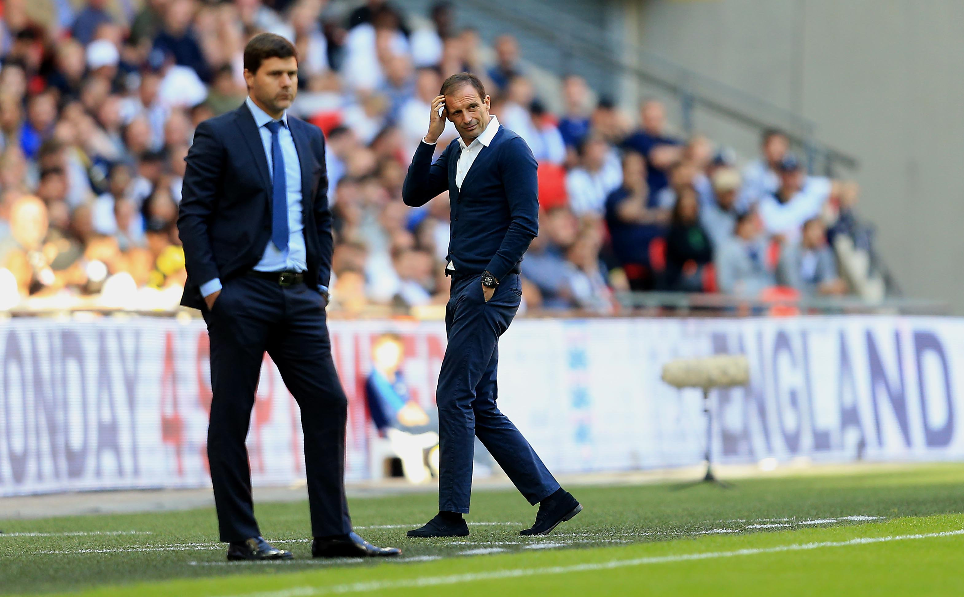 LONDON, ENGLAND - AUGUST 05: Juventus Manager Massimiliano Allegri walks past Tottenham Hotspur Manager Mauricio Pochettino during the Pre-Season Friendly match between Tottenham Hotspur and Juventus on August 5, 2017 in London, England. (Photo by Stephen Pond/Getty Images)