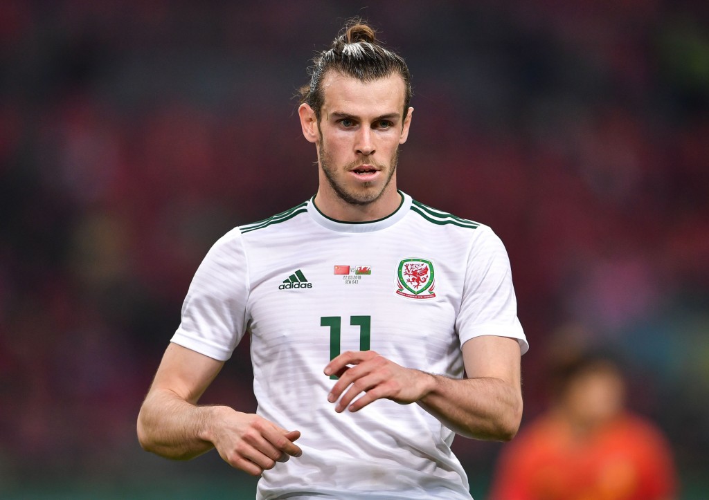Gareth Bale of Wales reacts during their China Cup International Football Championship Semi-final match against China in Nanning in China's southern Guangxi region on March 22, 2018. / AFP PHOTO / - / China OUT (Photo credit should read -/AFP/Getty Images)