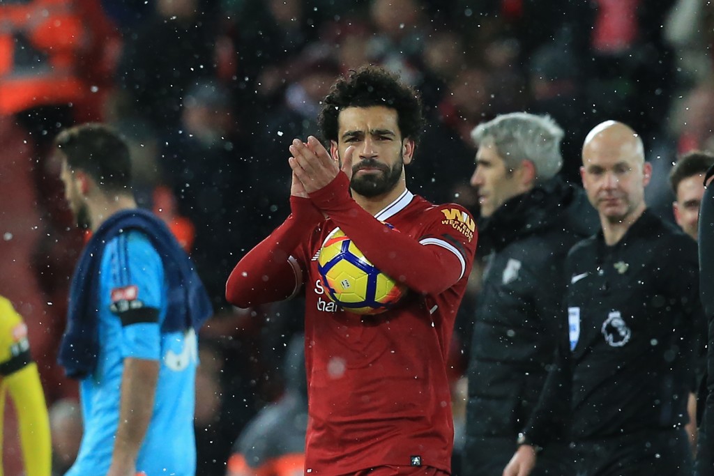 Liverpool's Egyptian midfielder Mohamed Salah gestures after the English Premier League football match between Liverpool and Watford at Anfield in Liverpool, north west England on March 17, 2018. / AFP PHOTO / Lindsey PARNABY / RESTRICTED TO EDITORIAL USE. No use with unauthorized audio, video, data, fixture lists, club/league logos or 'live' services. Online in-match use limited to 75 images, no video emulation. No use in betting, games or single club/league/player publications. / (Photo credit should read LINDSEY PARNABY/AFP/Getty Images)