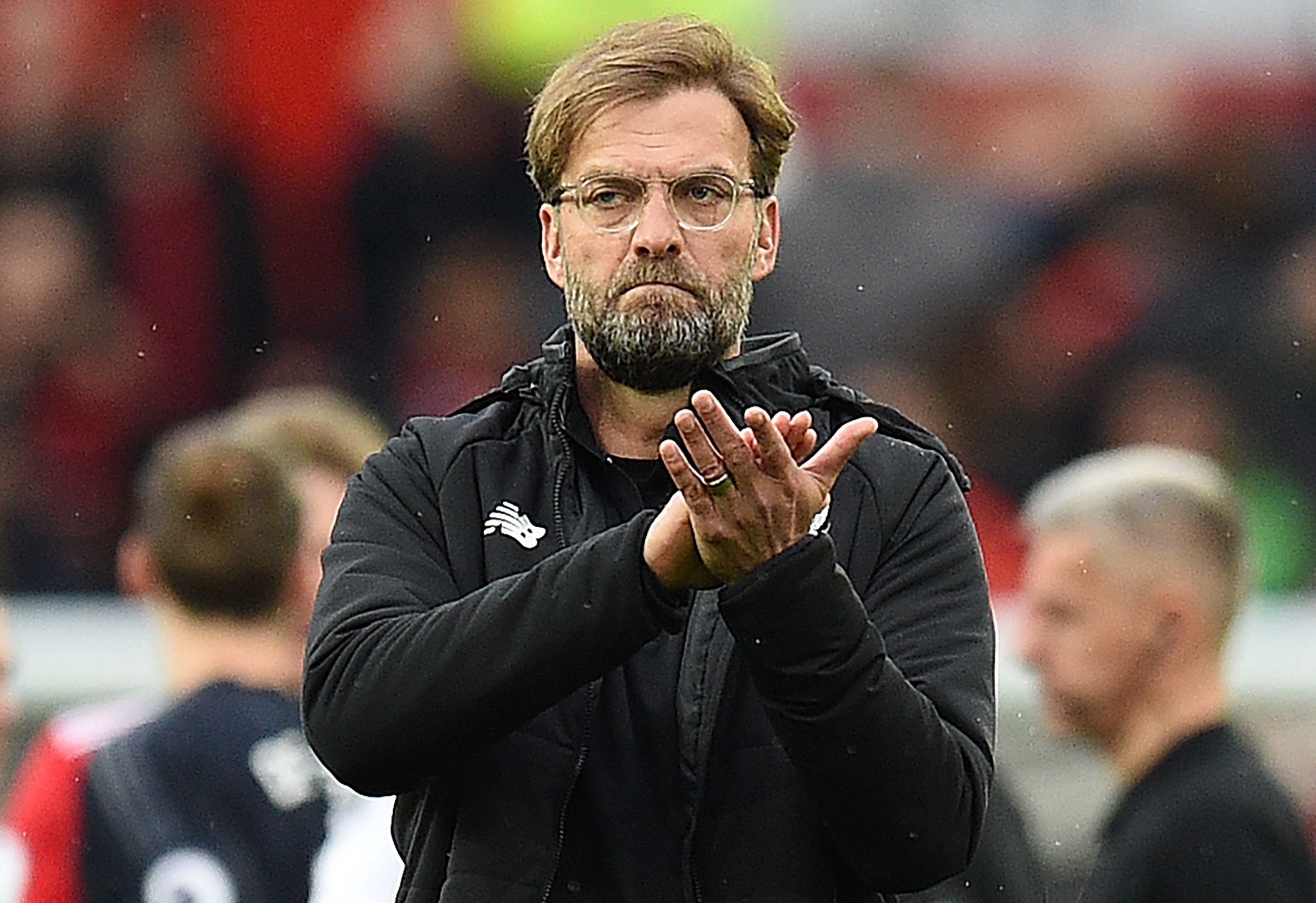 Liverpool's German manager Jurgen Klopp applauds at the end of the English Premier League football match between Manchester United and Liverpool at Old Trafford in Manchester, north west England, on March 10, 2018. / AFP PHOTO / Oli SCARFF / RESTRICTED TO EDITORIAL USE. No use with unauthorized audio, video, data, fixture lists, club/league logos or 'live' services. Online in-match use limited to 75 images, no video emulation. No use in betting, games or single club/league/player publications. / (Photo credit should read OLI SCARFF/AFP/Getty Images)