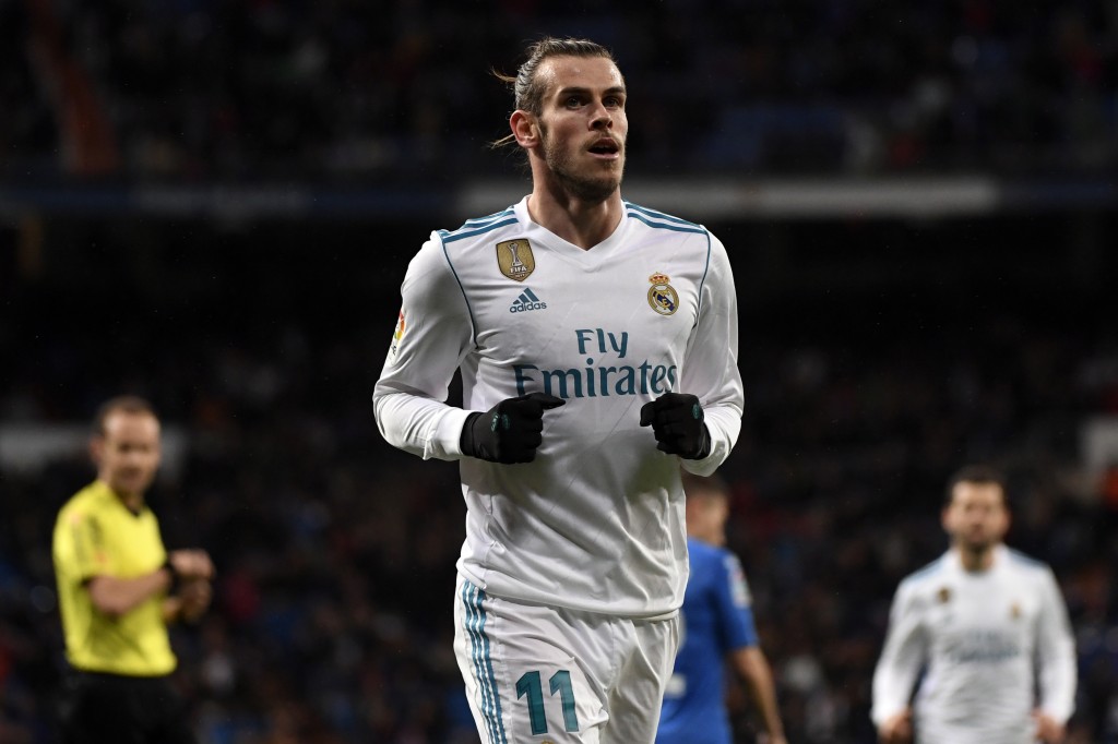 Real Madrid's Welsh forward Gareth Bale celebrates a goal during the Spanish league football match Real Madrid CF against Getafe CF at the Santiago Bernabeu stadium in Madrid on March 3, 2018. / AFP PHOTO / PIERRE-PHILIPPE MARCOU (Photo credit should read PIERRE-PHILIPPE MARCOU/AFP/Getty Images)