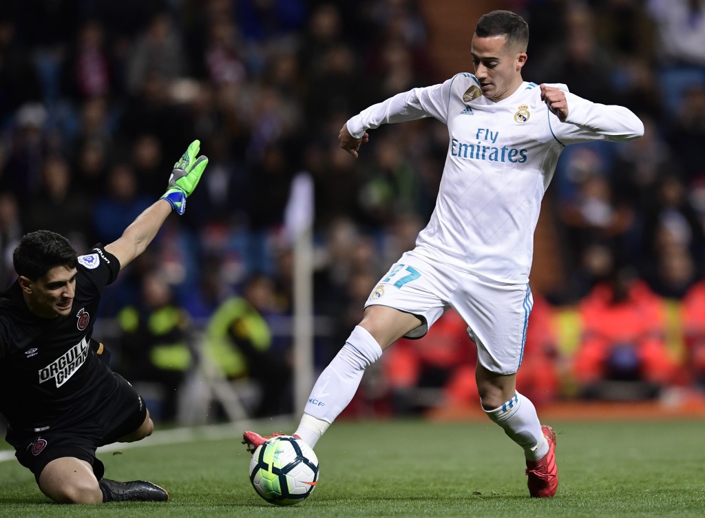 Real Madrid's Spanish midfielder Lucas Vazquez (R) vies with Girona's Moroccan goalkeeper Yassine Bounou during the Spanish League football match between Real Madrid CF and Girona FC at the Santiago Bernabeu stadium in Madrid on March 18, 2018. / AFP PHOTO / JAVIER SORIANO (Photo credit should read JAVIER SORIANO/AFP/Getty Images)