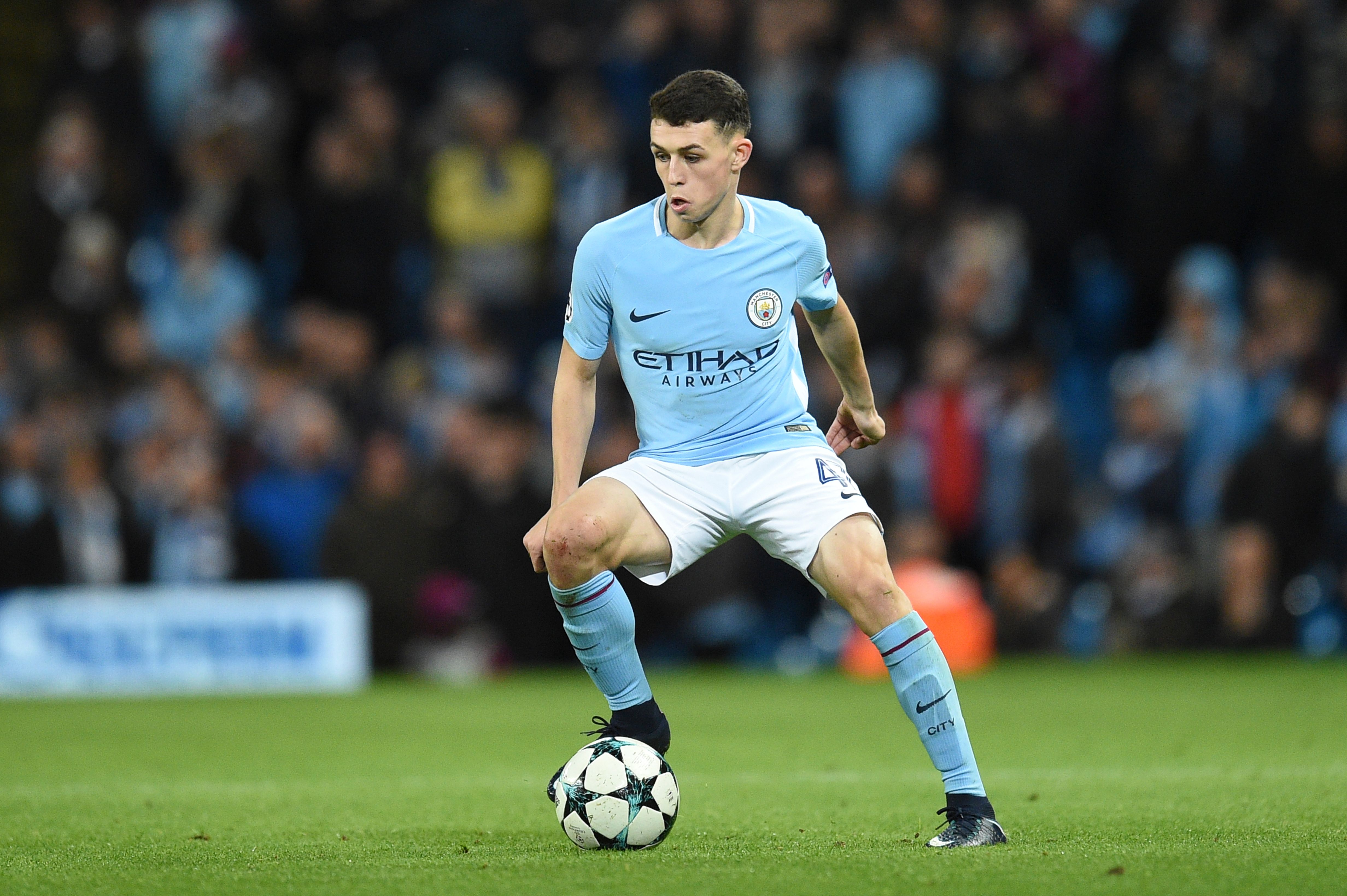Manchester City's English midfielder Phil Foden controls the ball during the UEFA Champions League Group F football match between Manchester City and Feyenoord at the Etihad Stadium in Manchester, north west England, on November 21, 2017. / AFP PHOTO / Oli SCARFF (Photo credit should read OLI SCARFF/AFP/Getty Images)