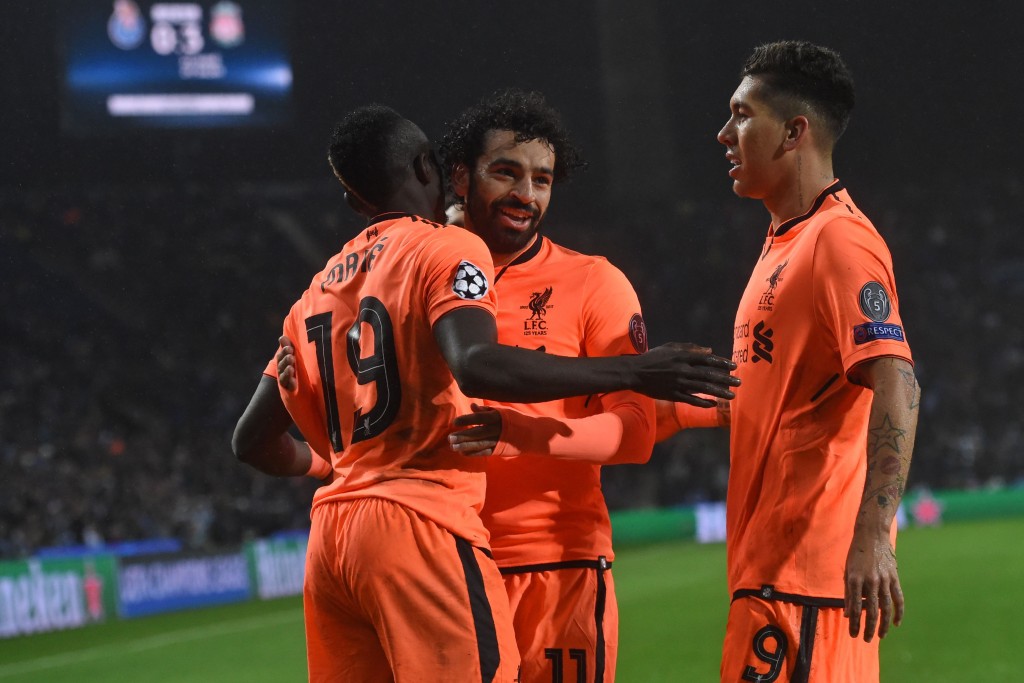 Liverpool's Senegalese midfielder Sadio Mane (L) celebrates with Liverpool's Egyptian midfielder Mohamed Salah and Liverpool's Brazilian midfielder Roberto Firmino (R) after scoring their third goal during the UEFA Champions League round of sixteen first leg football match between FC Porto and Liverpool at the Dragao stadium in Porto, Portugal on February 14, 2018. Liverpool won the game 5-0. / AFP PHOTO / Francisco LEONG (Photo credit should read FRANCISCO LEONG/AFP/Getty Images)