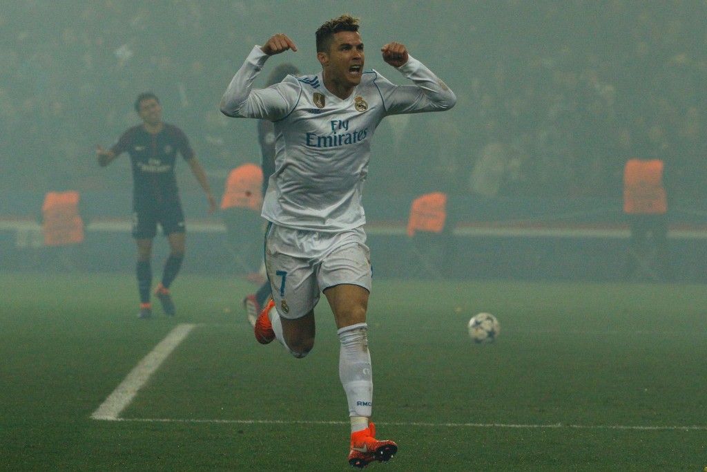 Real Madrid's Portuguese forward Cristiano Ronaldo celebrates after scoring the opening goal during the UEFA Champions League round of 16 second leg football match between Paris Saint-Germain (PSG) and Real Madrid on March 6, 2018, at the Parc des Princes stadium in Paris. / AFP PHOTO / GEOFFROY VAN DER HASSELT (Photo credit should read GEOFFROY VAN DER HASSELT/AFP/Getty Images)
