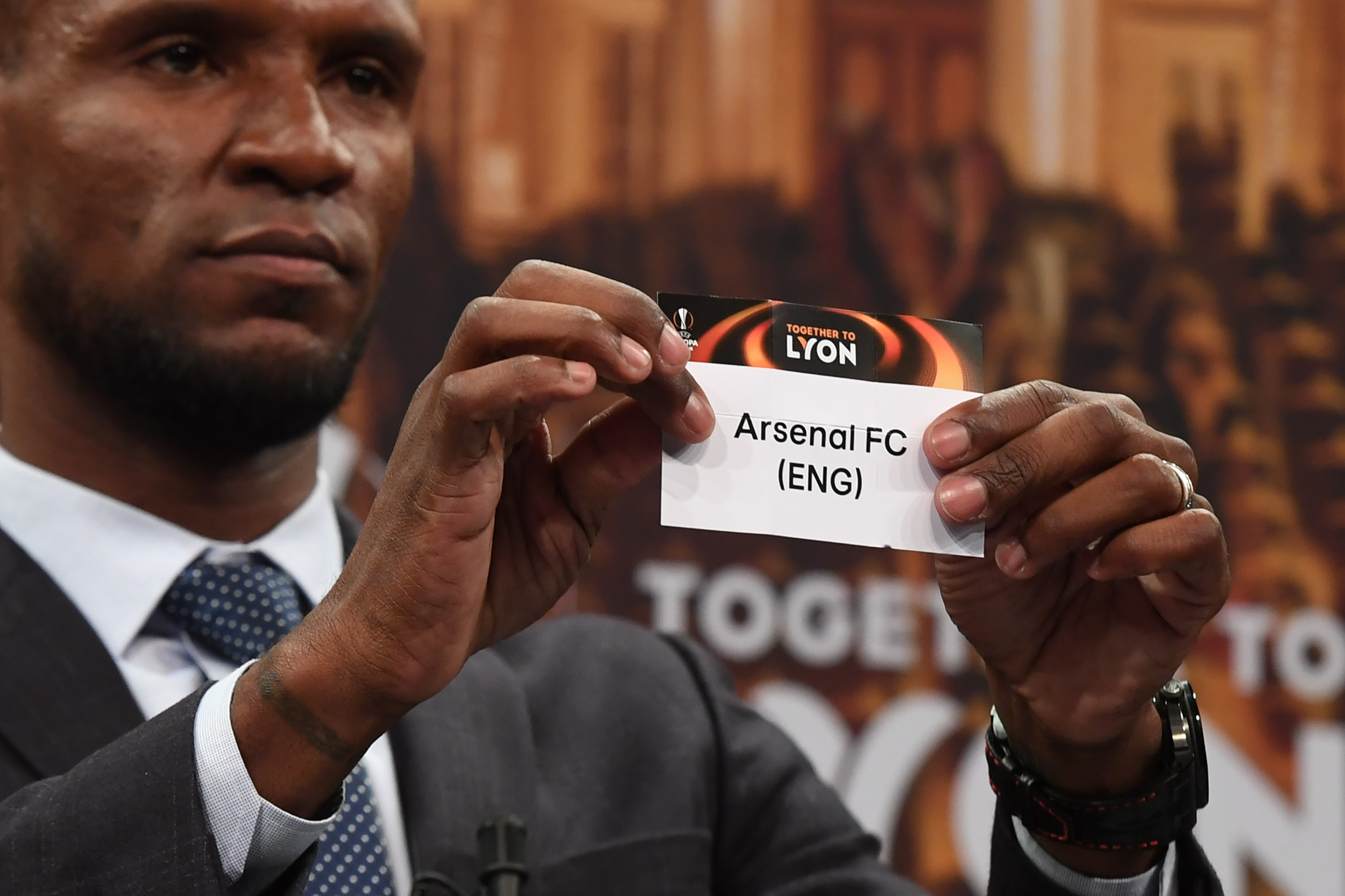 Barcelona and Lyon's former player Eric Abidal shows the name of Arsenal FC during the draw for the round of 16 of the UEFA Europa League football tournament at the UEFA headquarters in Nyon, Switzerland on February 23, 2018.
/ AFP PHOTO / jean-guy PYTHON (Photo credit should read JEAN-GUY PYTHON/AFP/Getty Images)
