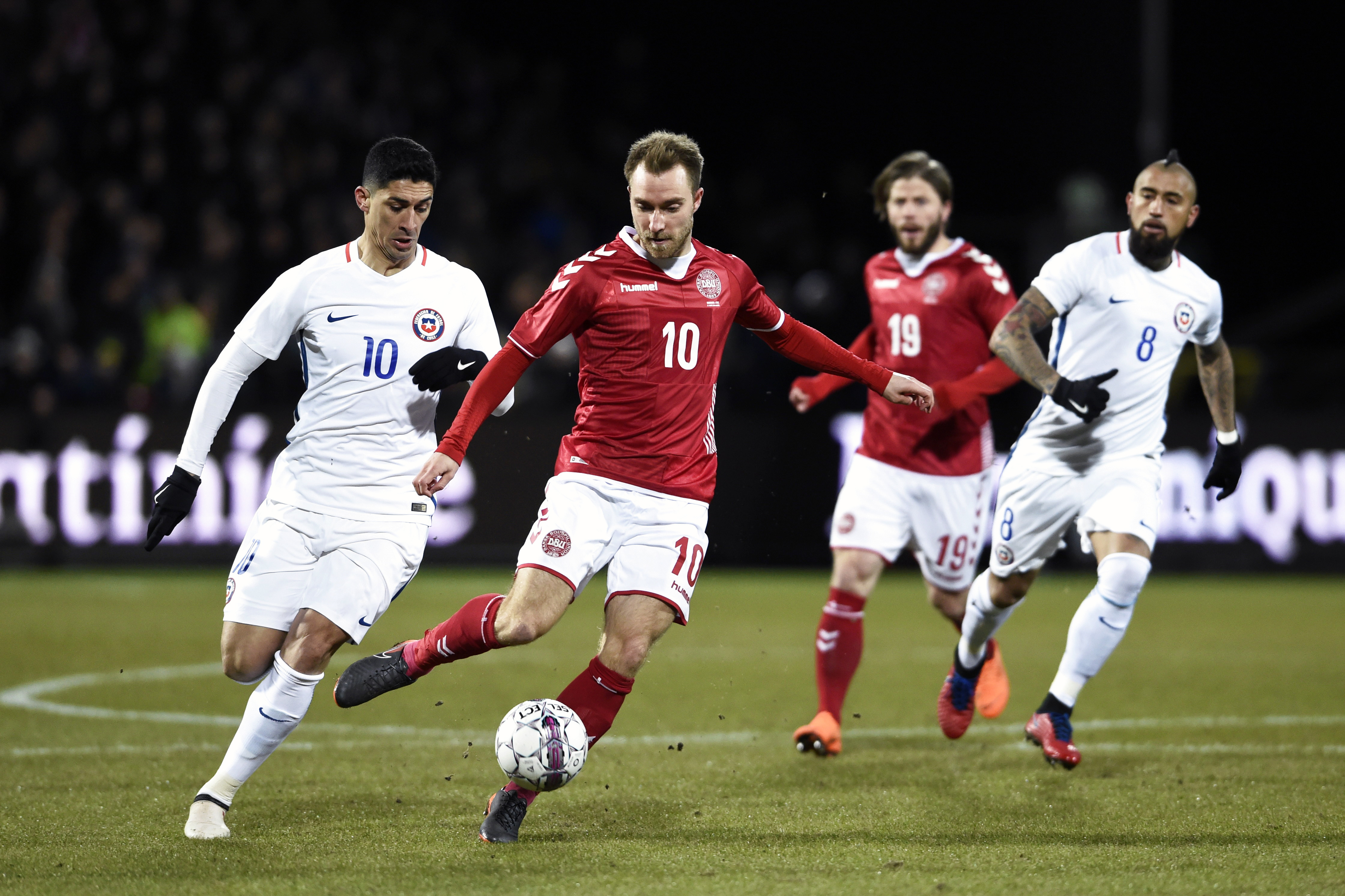 Denmark's Christian Eriksen (2L) and Chile's Pedro Pablo Hernandez vie for the ball during their international friendly football match between Denmark and Chile in Aalborg, Denmark on March 27, 2018. / AFP PHOTO / Ritzau Scanpix AND Scanpix / Henning Bagger / Denmark OUT (Photo credit should read HENNING BAGGER/AFP/Getty Images)