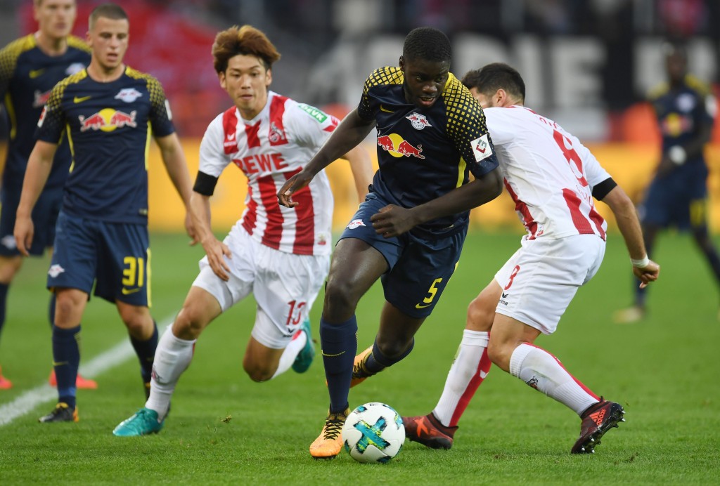 Cologne's Serbian midfielder Milos Jojic (R), Cologne's Japanese striker Yuya Osako and Leipzig's French defender Dayot Upamecano vie for the ball during the German First division Bundesliga football match FC Cologne v RB Leipzig in Cologne, western Germany, on October 1, 2017. / AFP PHOTO / PATRIK STOLLARZ / RESTRICTIONS: DURING MATCH TIME: DFL RULES TO LIMIT THE ONLINE USAGE TO 15 PICTURES PER MATCH AND FORBID IMAGE SEQUENCES TO SIMULATE VIDEO. == RESTRICTED TO EDITORIAL USE == FOR FURTHER QUERIES PLEASE CONTACT DFL DIRECTLY AT + 49 69 650050 / RESTRICTIONS: DURING MATCH TIME: DFL RULES TO LIMIT THE ONLINE USAGE TO 15 PICTURES PER MATCH AND FORBID IMAGE SEQUENCES TO SIMULATE VIDEO. == RESTRICTED TO EDITORIAL USE == FOR FURTHER QUERIES PLEASE CONTACT DFL DIRECTLY AT + 49 69 650050 (Photo credit should read PATRIK STOLLARZ/AFP/Getty Images)