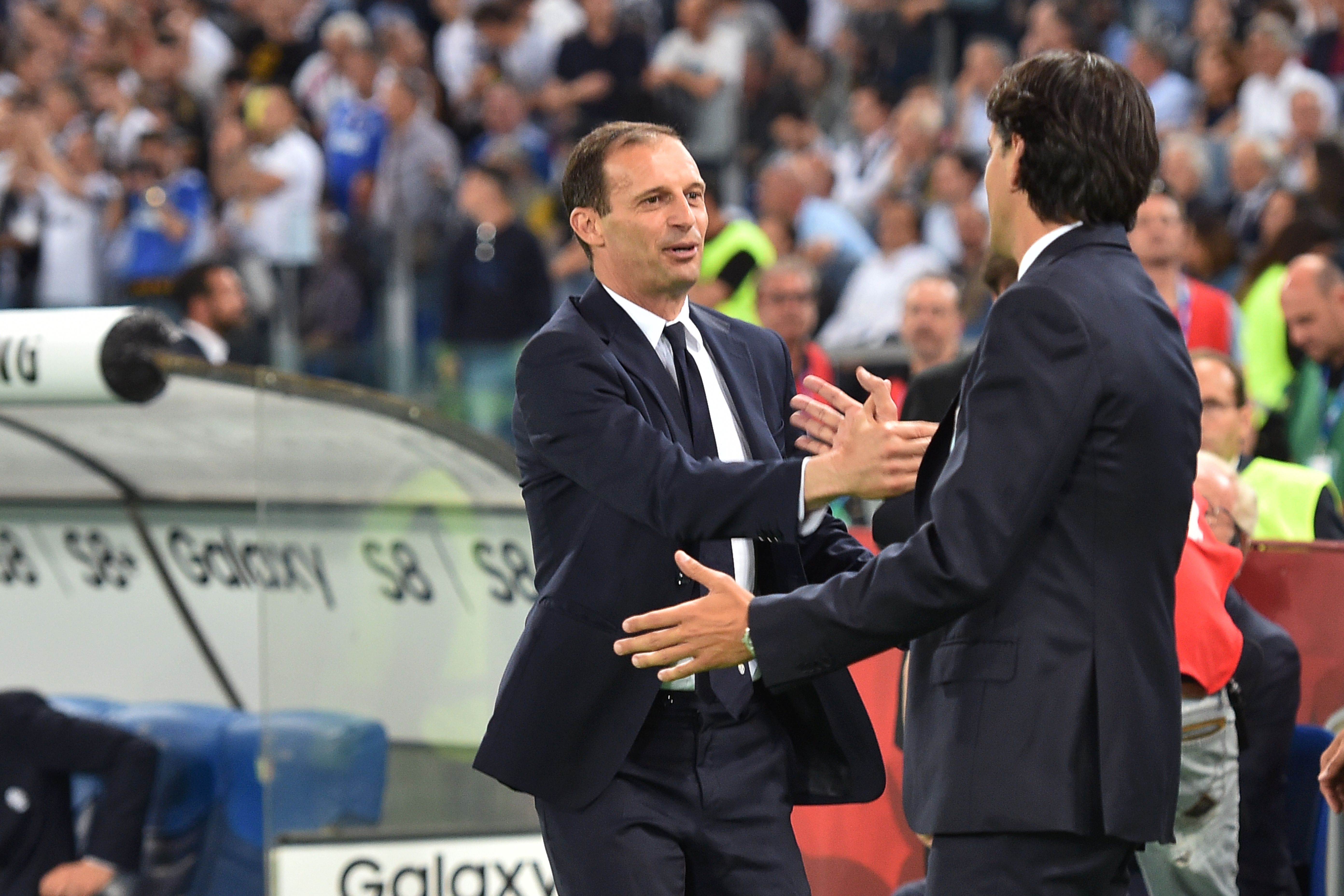 Lazio's coach from Italy Simone Inzaghi (R) greets Juventus' coach from Italy Massimiliano Allegri before the Italian Tim Cup final on May 17, 2017 at the Olympic stadium in Rome. / AFP PHOTO / Andreas SOLARO (Photo credit should read ANDREAS SOLARO/AFP/Getty Images)