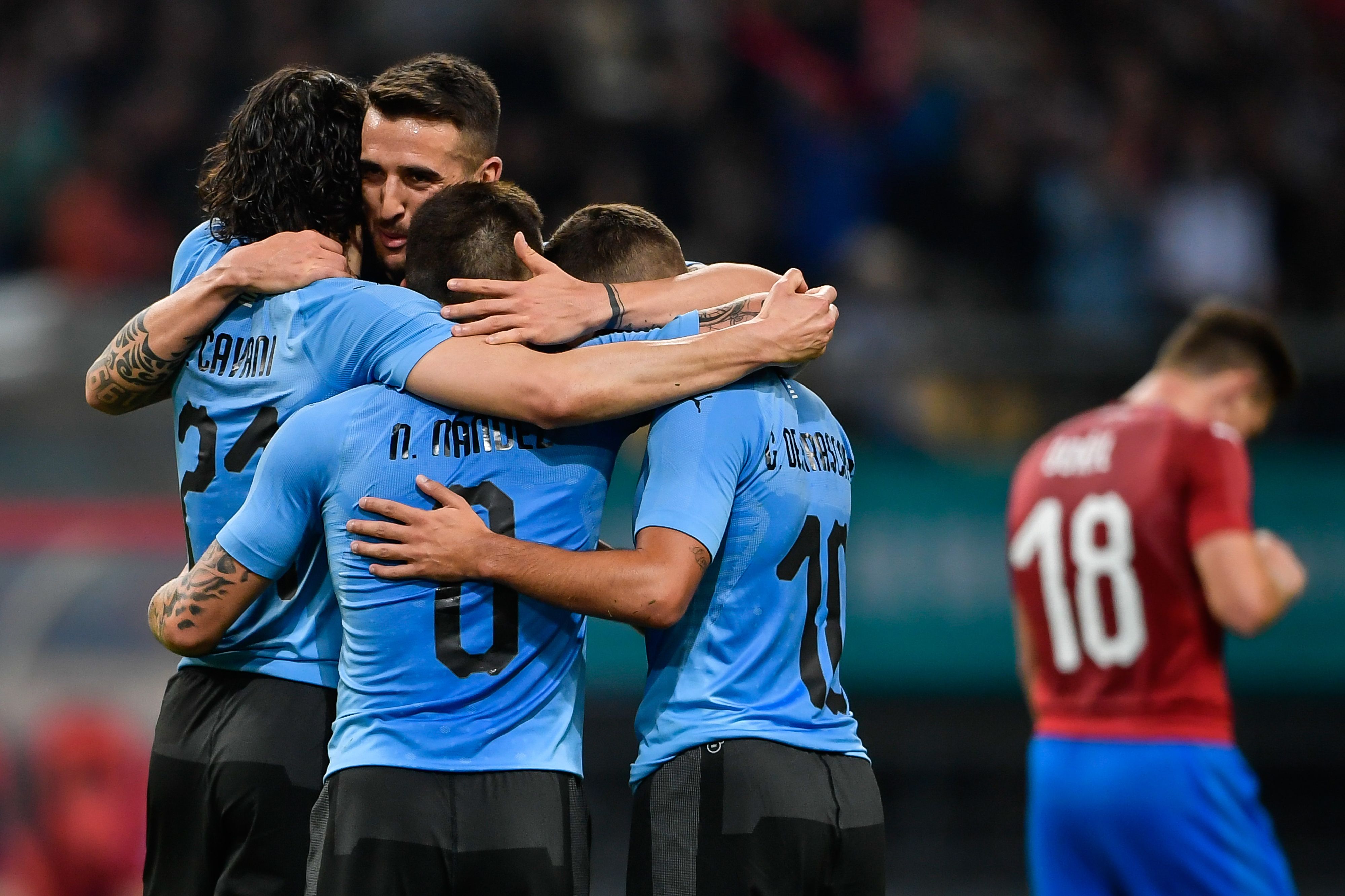 Players of Uruguay celebrate during their China Cup International Football Championship Semi-final match against Czech in Nanning in China's southern Guangxi region on March 23, 2018. / AFP PHOTO / - / China OUT (Photo credit should read -/AFP/Getty Images)