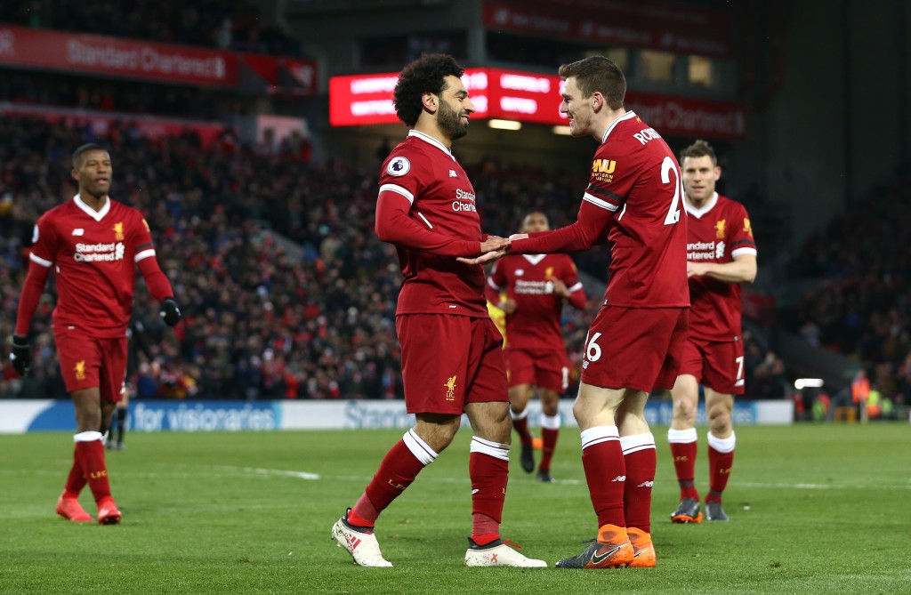 LIVERPOOL, ENGLAND - MARCH 17: Mohamed Salah of Liverpool celebrates scoring his side's second goal with Andy Robertson during the Premier League match between Liverpool and Watford at Anfield on March 17, 2018 in Liverpool, England. (Photo by Jan Kruger/Getty Images)