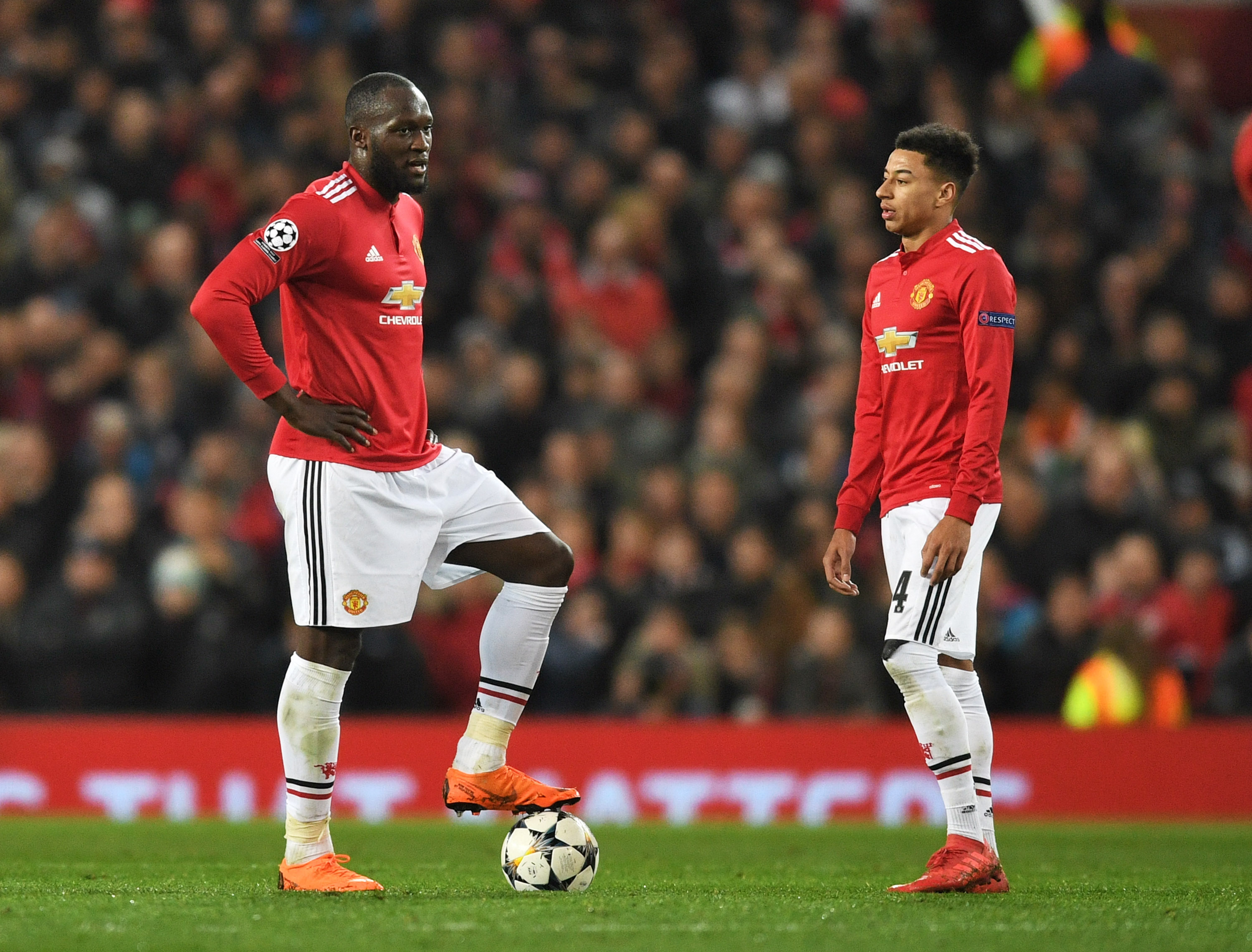 MANCHESTER, ENGLAND - MARCH 13: Romelu Lukaku and Jesse Lingard of Manchester United look dejected during the UEFA Champions League Round of 16 Second Leg match between Manchester United and Sevilla FC at Old Trafford on March 13, 2018 in Manchester, United Kingdom. (Photo by Michael Regan/Getty Images)