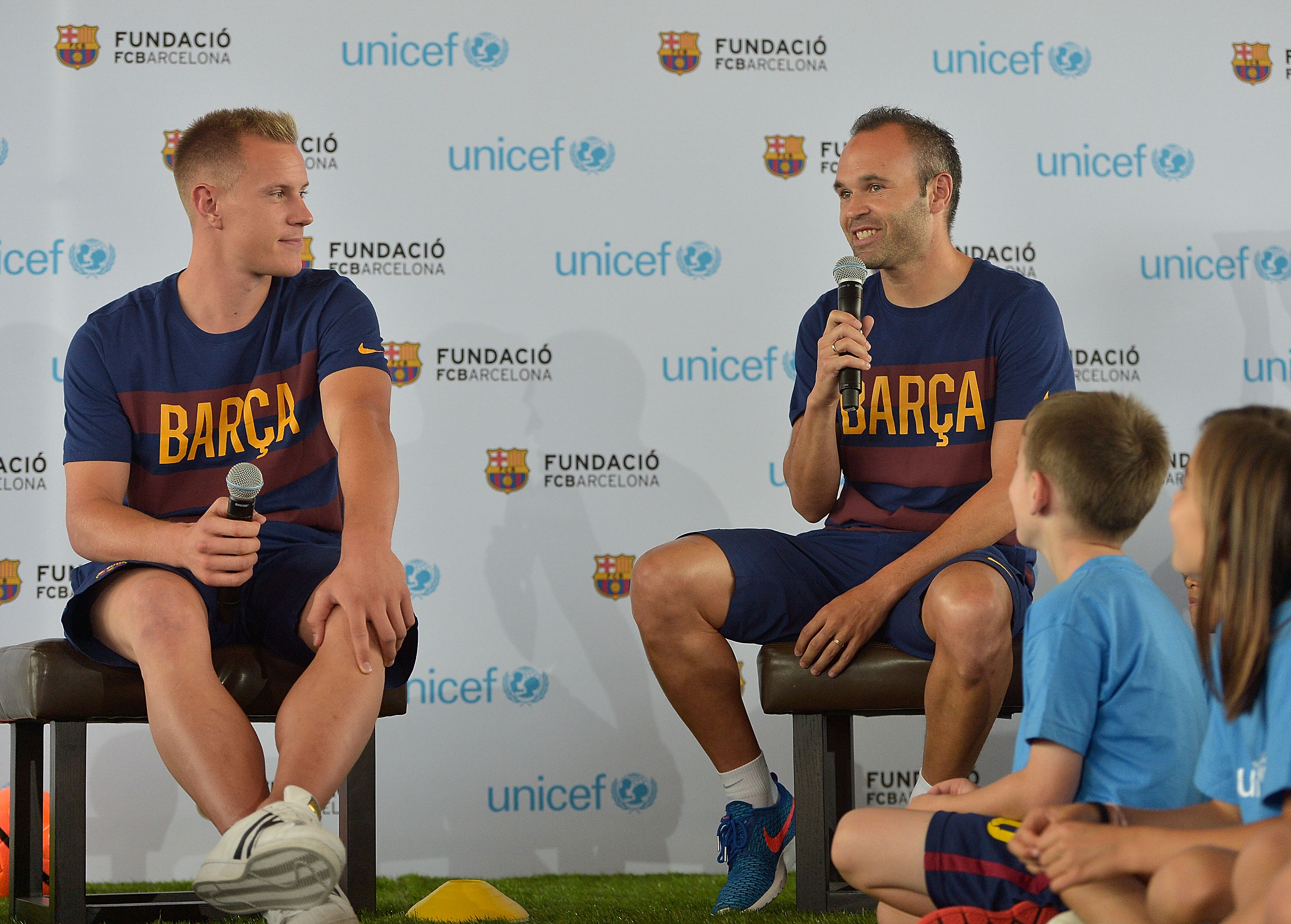 MARINA DEL REY, CA - JULY 20: Professional soccer players Marc-Andre ter Stegen (L) and Andres Iniesta attend UNICEF And FC Barcelona Host An Event Where Children Talk About Empowering Lives Through Sport With FCB Players on July 20, 2015 in Marina del Rey, California. (Photo by Charley Gallay/Getty Images for UNICEF)