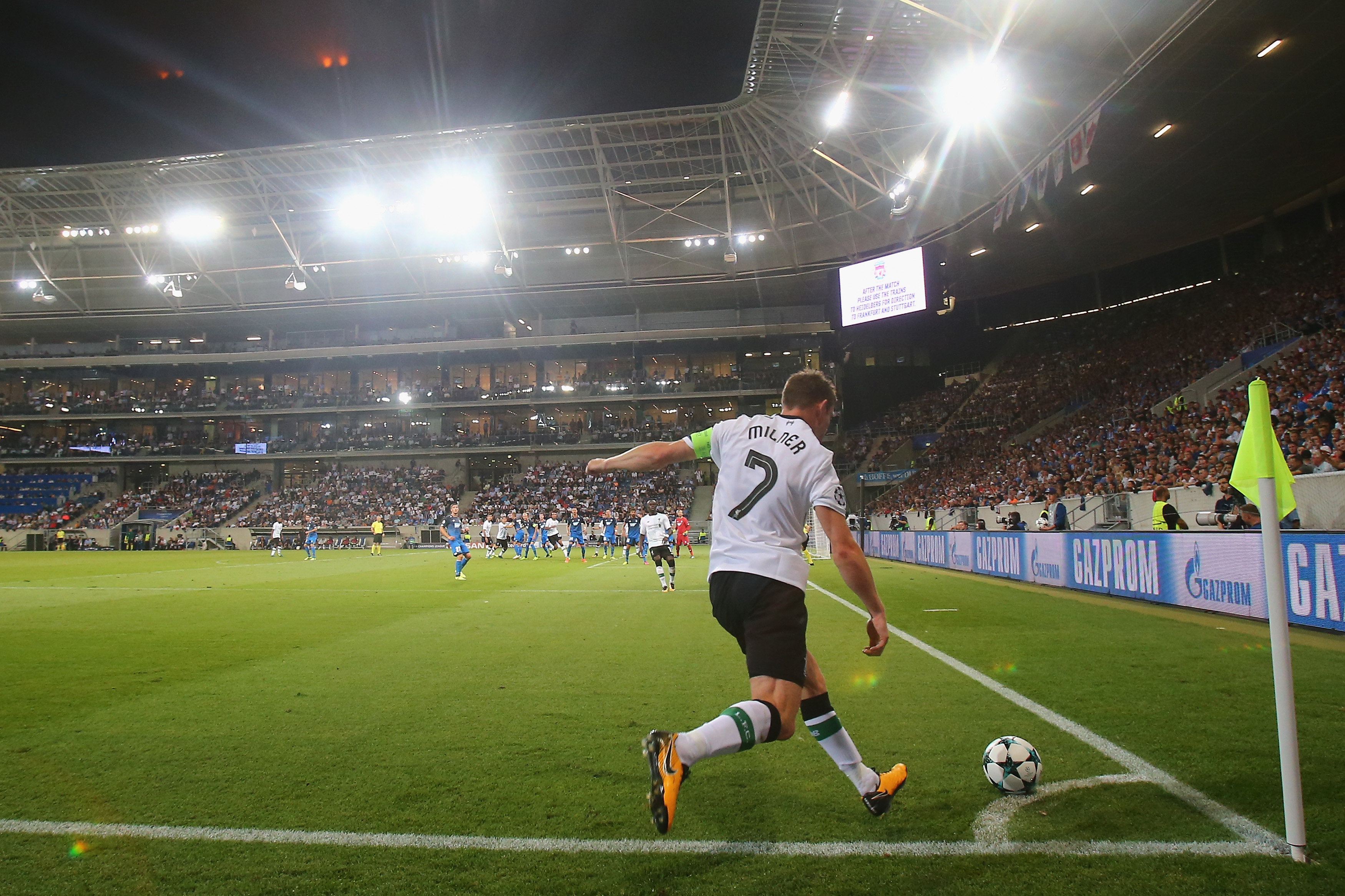 SINSHEIM, GERMANY - AUGUST 15: James Milner of Liverpool shoots a corner during the UEFA Champions League Qualifying Play-Offs Round First Leg match between 1899 Hoffenheim and Liverpool FC at Wirsol Rhein-Neckar-Arena on August 15, 2017 in Sinsheim, Germany. (Photo by Alex Grimm/Bongarts/Getty Images)