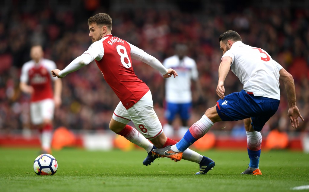 LONDON, ENGLAND - APRIL 01: Erik Pieters of Stoke City fouls Aaron Ramsey of Arsenal during the Premier League match between Arsenal and Stoke City at Emirates Stadium on April 1, 2018 in London, England. (Photo by Mike Hewitt/Getty Images)