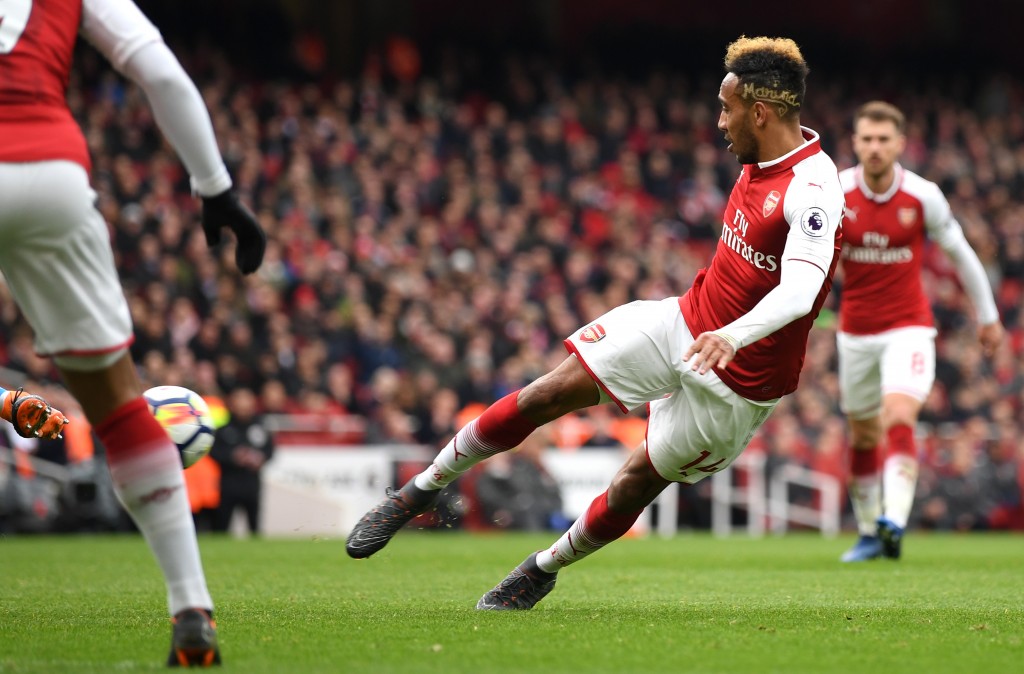 LONDON, ENGLAND - APRIL 01: Pierre-Emerick Aubameyang of Arsenal scores his sides second goal during the Premier League match between Arsenal and Stoke City at Emirates Stadium on April 1, 2018 in London, England. (Photo by Shaun Botterill/Getty Images)