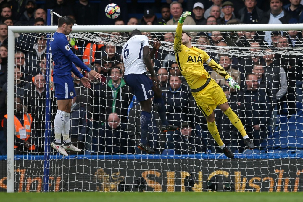 Tottenham Hotspur's French goalkeeper Hugo Lloris (R) fails to get to the ball as Chelsea's Spanish striker Alvaro Morata (L) jumps to head the opening goal of the English Premier League football match between Chelsea and Tottenham Hotspur at Stamford Bridge in London on April 1, 2018. / AFP PHOTO / Daniel LEAL-OLIVAS / RESTRICTED TO EDITORIAL USE. No use with unauthorized audio, video, data, fixture lists, club/league logos or 'live' services. Online in-match use limited to 75 images, no video emulation. No use in betting, games or single club/league/player publications. / (Photo credit should read DANIEL LEAL-OLIVAS/AFP/Getty Images)