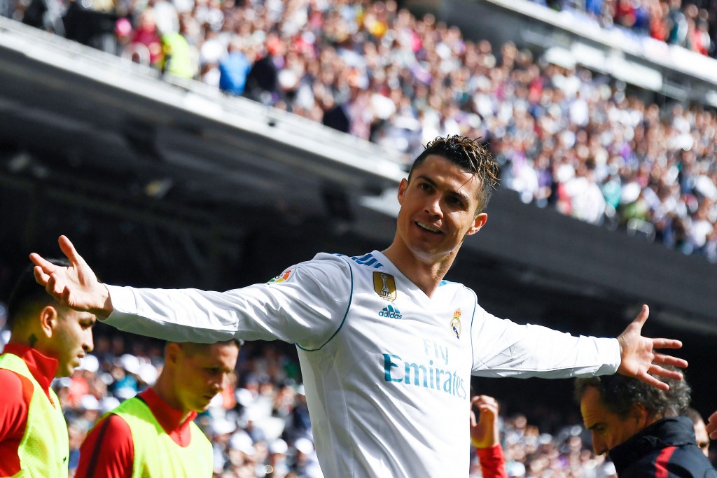 Real Madrid's Portuguese forward Cristiano Ronaldo celebrates after scoring a goal during the Spanish league football match between Real Madrid CF and Club Atletico de Madrid at the Santiago Bernabeu stadium in Madrid on April 8, 2018. / AFP PHOTO / GABRIEL BOUYS (Photo credit should read GABRIEL BOUYS/AFP/Getty Images)