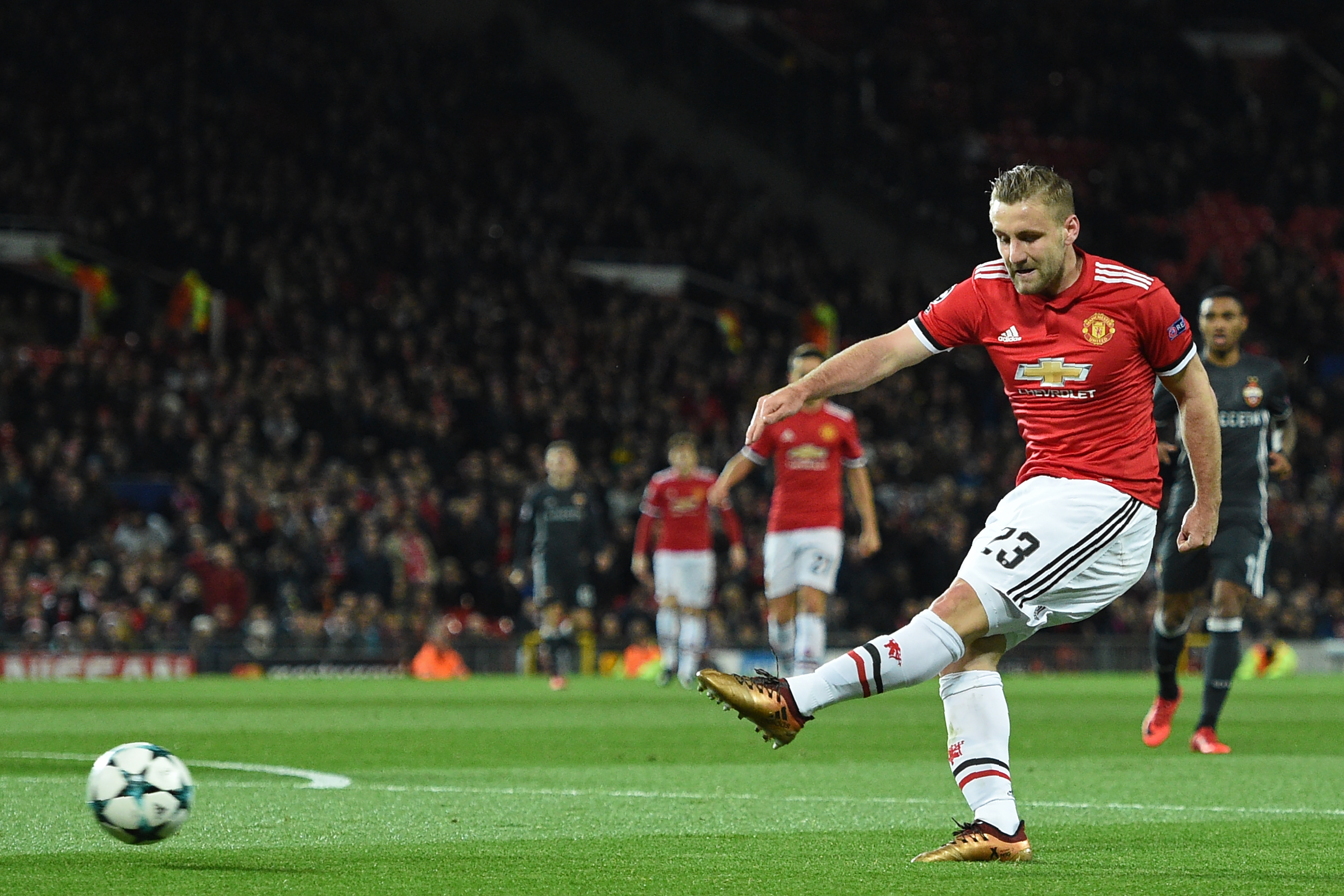 Manchester United's English defender Luke Shaw has an unsuccessful shot during the UEFA Champions League Group A football match between Manchester United and CSKA Moscow at Old Trafford in Manchester, north west England on December 5, 2017. / AFP PHOTO / Oli SCARFF (Photo credit should read OLI SCARFF/AFP/Getty Images)