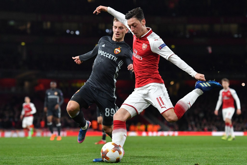 Arsenal's German midfielder Mesut Ozil crosses the ball during the UEFA Europa League first leg quarter-final football match between Arsenal and CSKA Moscow at the Emirates Stadium in London on April 5, 2018. / AFP PHOTO / Ben STANSALL (Photo credit should read BEN STANSALL/AFP/Getty Images)