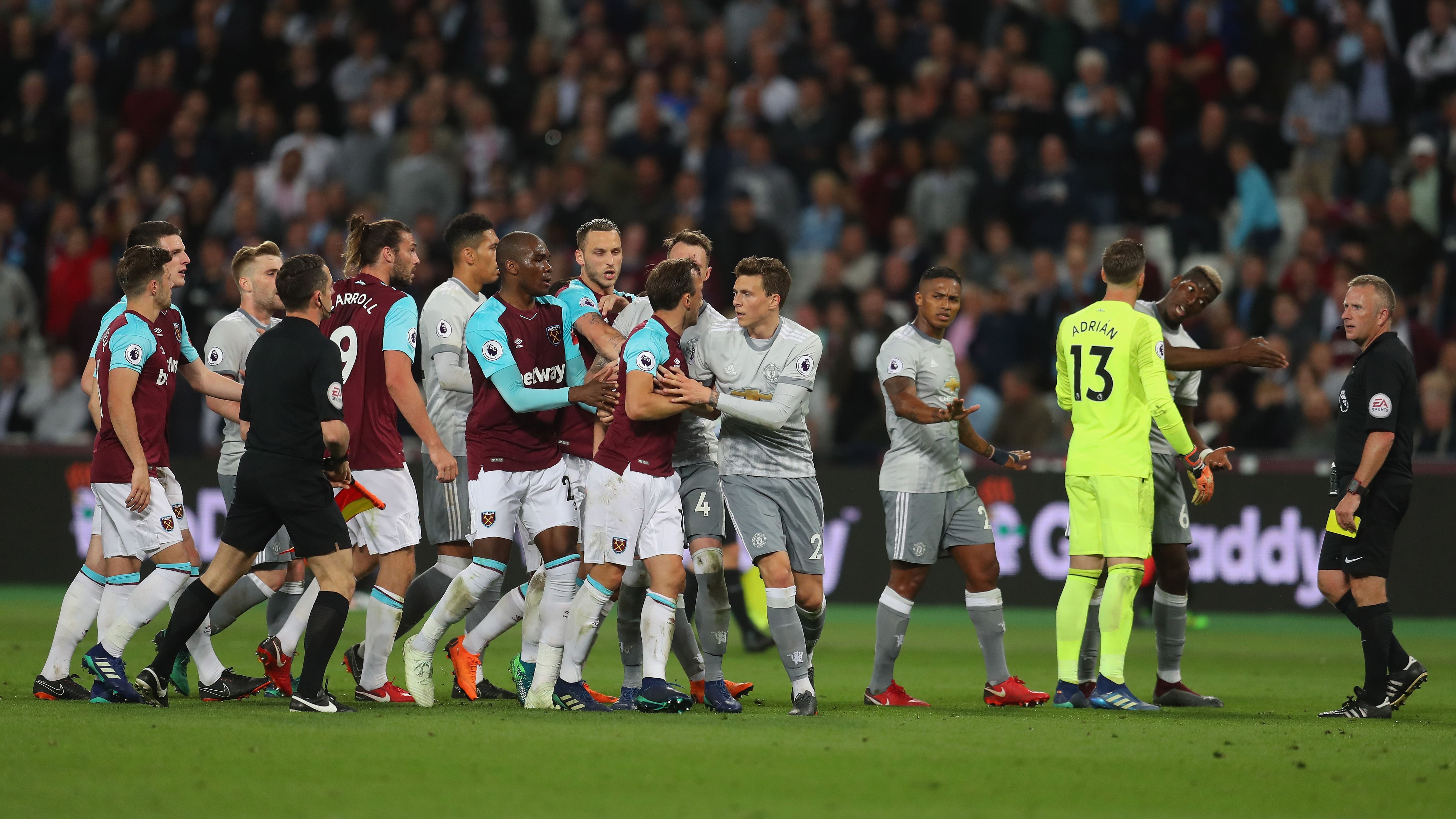 LONDON, ENGLAND - MAY 10: Paul Pogba of Manchester United speaks to referee Jonathan Moss as Mark Noble of West Ham United gets upset during the Premier League match between West Ham United and Manchester United at London Stadium on May 10, 2018 in London, England. (Photo by Catherine Ivill/Getty Images)