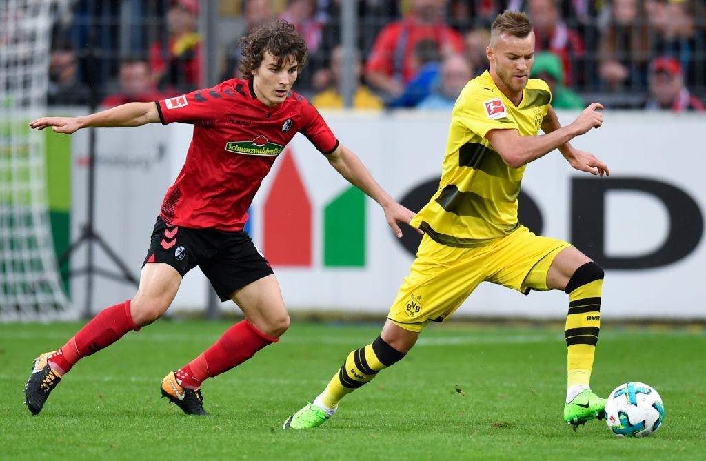 Is Caglar Soyuncu (L) Arsenal bound? (Photo courtesy THOMAS KIENZLE/AFP/Getty Images)