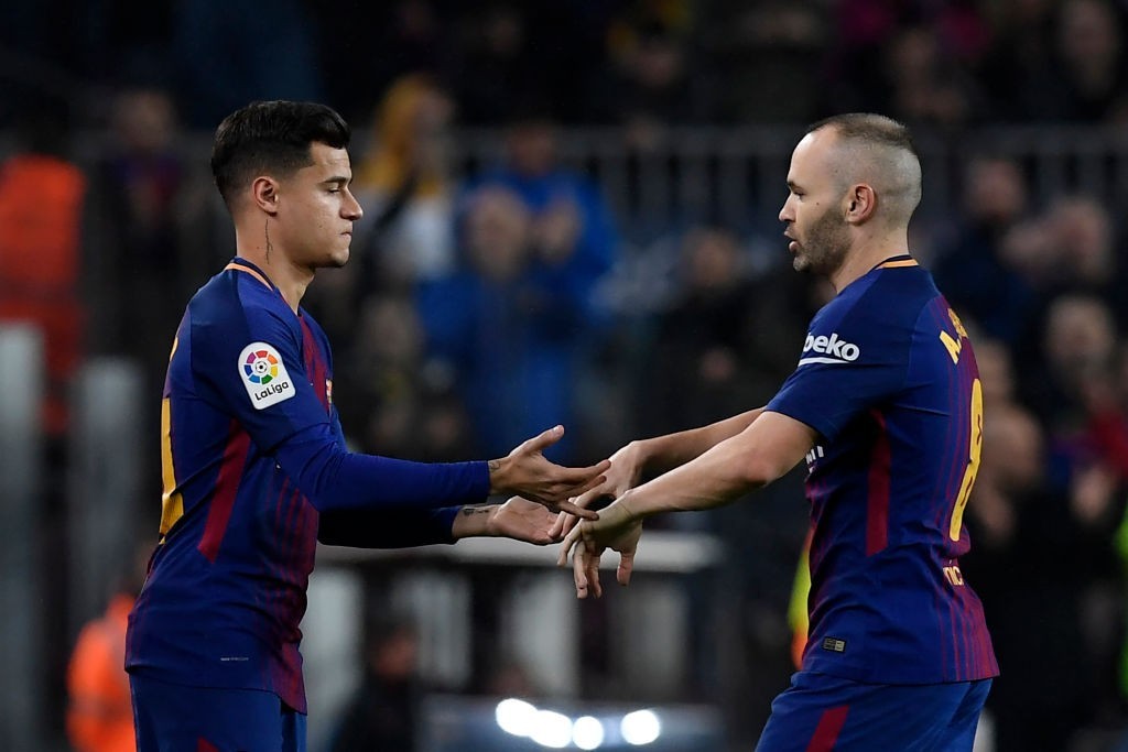 Passing on the baton (Photo: LLUIS GENE/AFP/Getty Images)