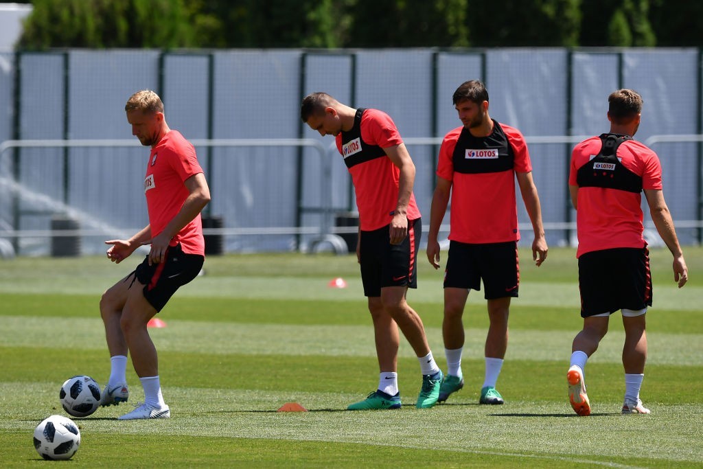 Fit again Kamil Glik (L) will solidify Poland's rearguard (Photo by NELSON ALMEIDA/AFP/Getty Images)