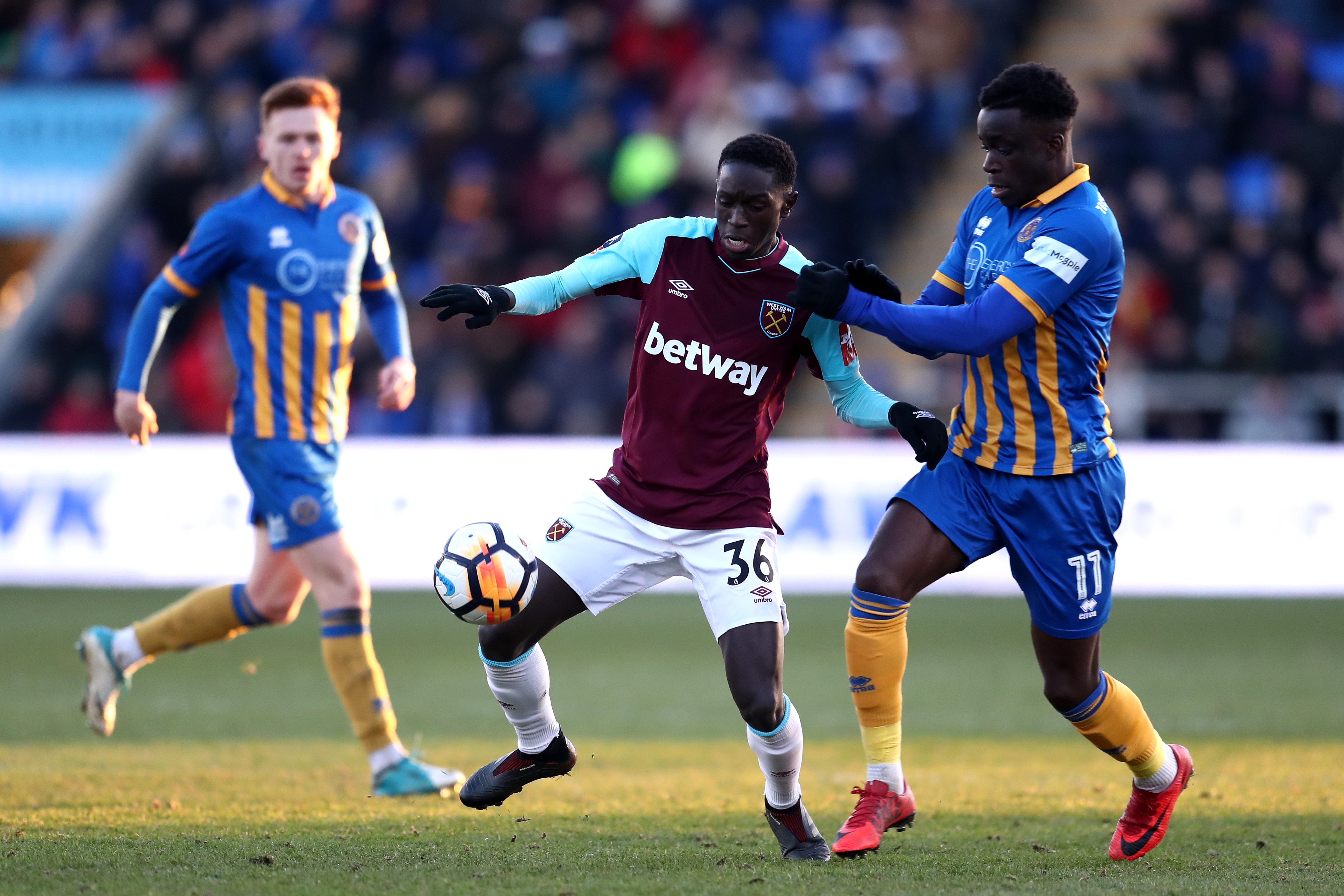 SHREWSBURY, ENGLAND - JANUARY 07: Domingos Quina of West Ham United is challenged by Arthur Gnahoua of Shrewsbury Town during The Emirates FA Cup Third Round match between Shrewsbury Town and West Ham United at Montgomery Waters Meadow on January 7, 2018 in Shrewsbury, England. (Photo by Catherine Ivill/Getty Images)