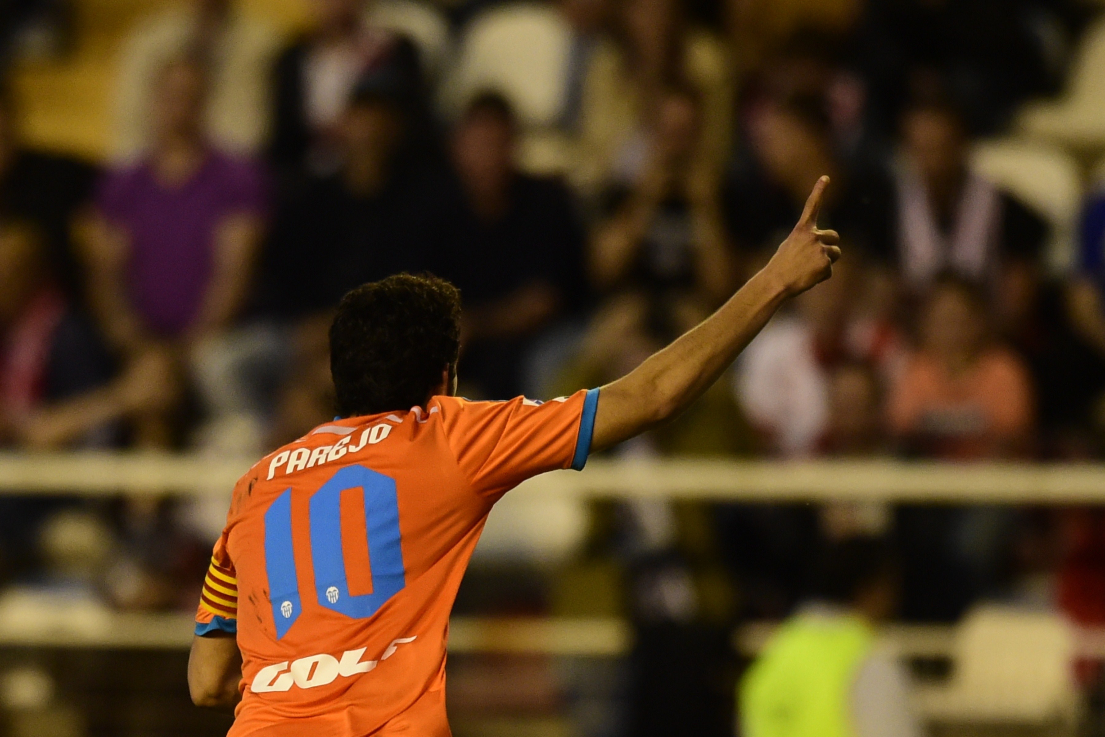 Valencia's midfielder Dani Parejo celebrates after scoring a goal during the Spanish league football match Rayo Vallecano de Madrid vs Valencia CF at Vallecas stadium in Madrid on April 30, 2015. AFP PHOTO/ JAVIER SORIANO (Photo credit should read JAVIER SORIANO/AFP/Getty Images)