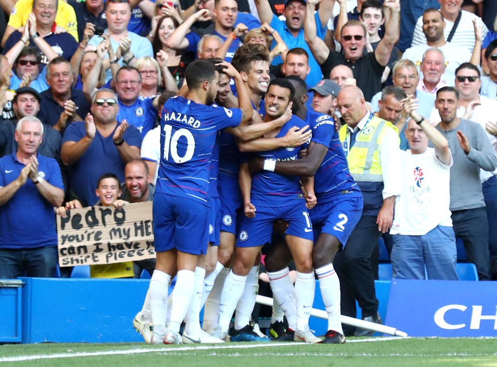 LONDON, ENGLAND - SEPTEMBER 01: Pedro of Chelsea celebrates with teammates after scoring his team's first goal during the Premier League match between Chelsea FC and AFC Bournemouth at Stamford Bridge on September 1, 2018 in London, United Kingdom. (Photo by Clive Rose/Getty Images)