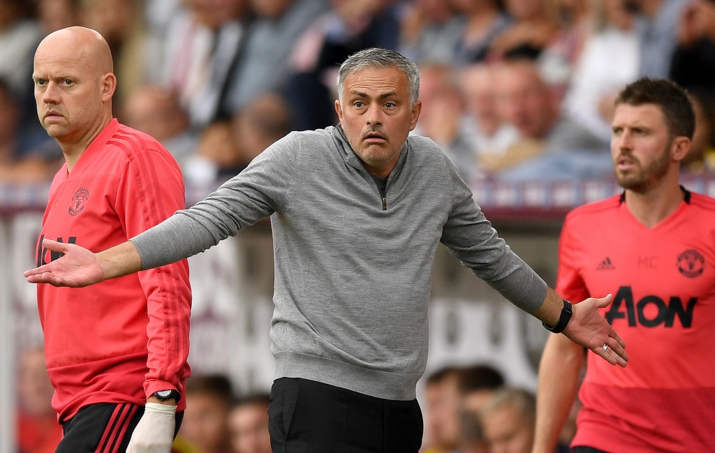 Manchester United fans reacting to Jon Moss and his decisions. (Picture Courtesy - AFP/Getty Images)
