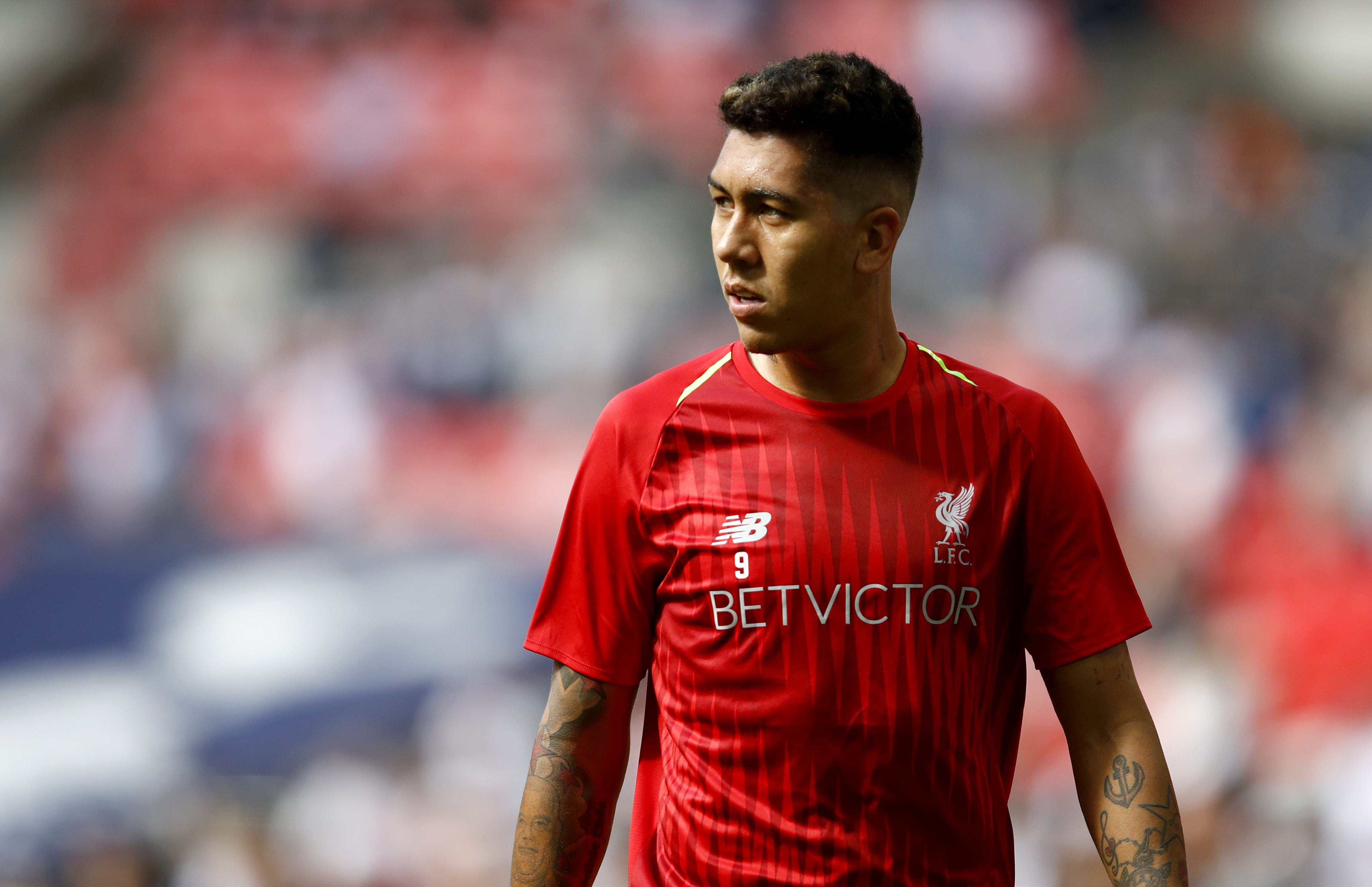 LONDON, ENGLAND - SEPTEMBER 15: Roberto Firmino of Liverpool warms up ahead of the Premier League match between Tottenham Hotspur and Liverpool FC at Wembley Stadium on September 15, 2018 in London, United Kingdom. (Photo by Julian Finney/Getty Images)
