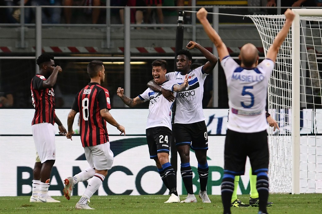 Rigoni (C) made Milan pay for their missed chances (Photo by MARCO BERTORELLO/AFP/Getty Images)