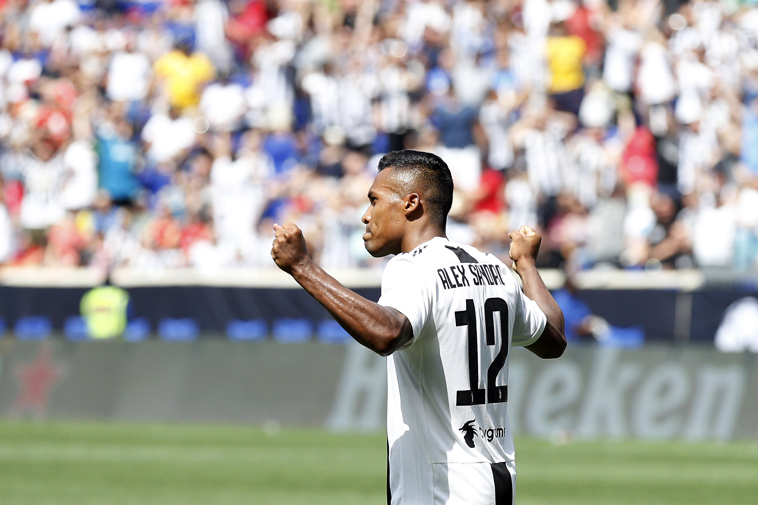 HARRISON, NJ - JULY 28: Alex Sandro #12 of Juventus celebrates his game winning goal in penalty kicks against Benfica during the International Champions Cup 2018 match between Benfica and Juventus at Red Bull Arena on July 28, 2018 in Harrison, New Jersey. (Photo by Adam Hunger/Getty Images)