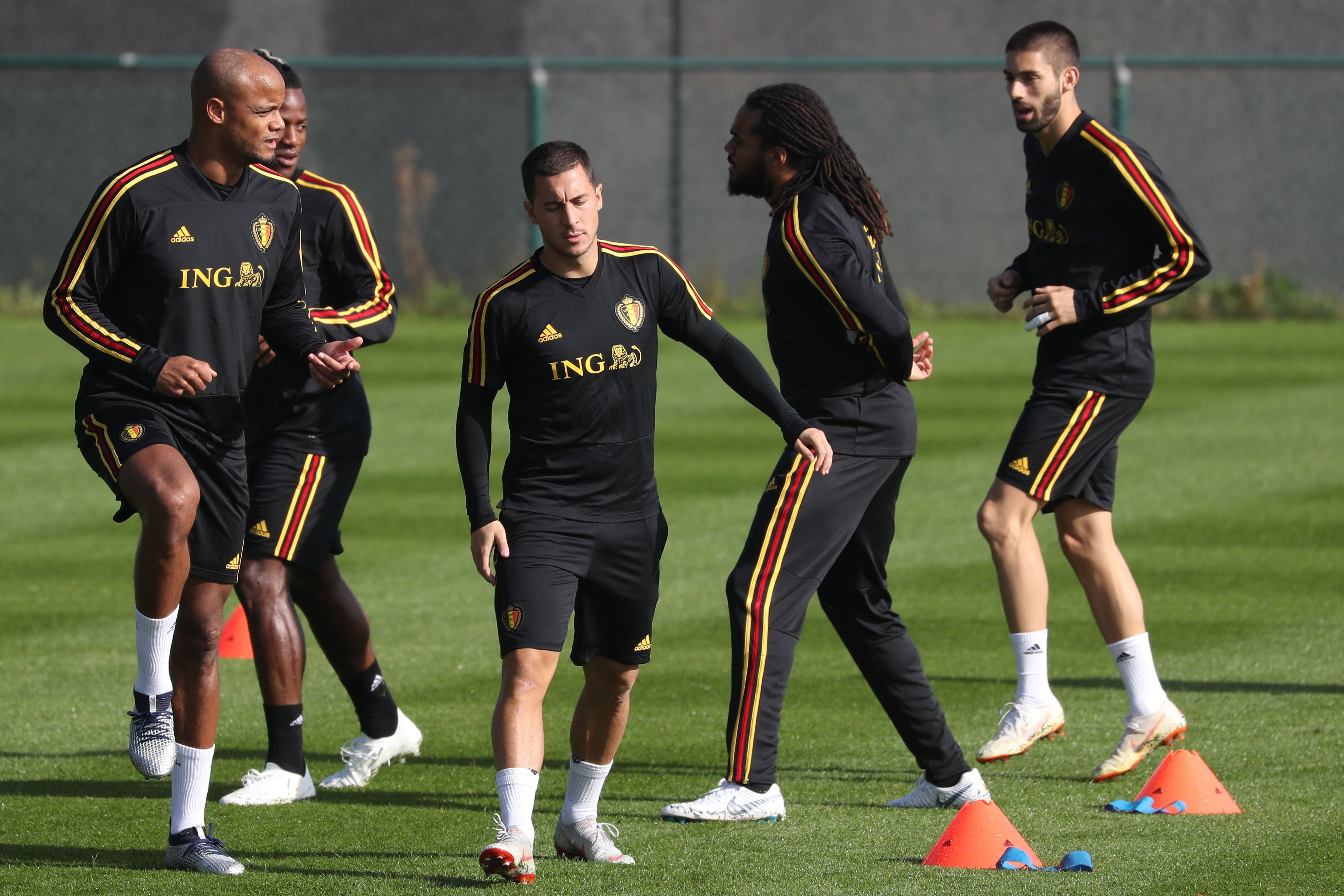 Belgium's players Vincent Kompany (L) and Eden Hazard (3rdL) take part in a training session of Belgian football national team the Red Devils in Tubize, on October 9, 2018, ahead the upcoming Nations League football match against Switzerland. (Photo by VIRGINIE LEFOUR / BELGA / AFP) / Belgium OUT (Photo credit should read VIRGINIE LEFOUR/AFP/Getty Images)