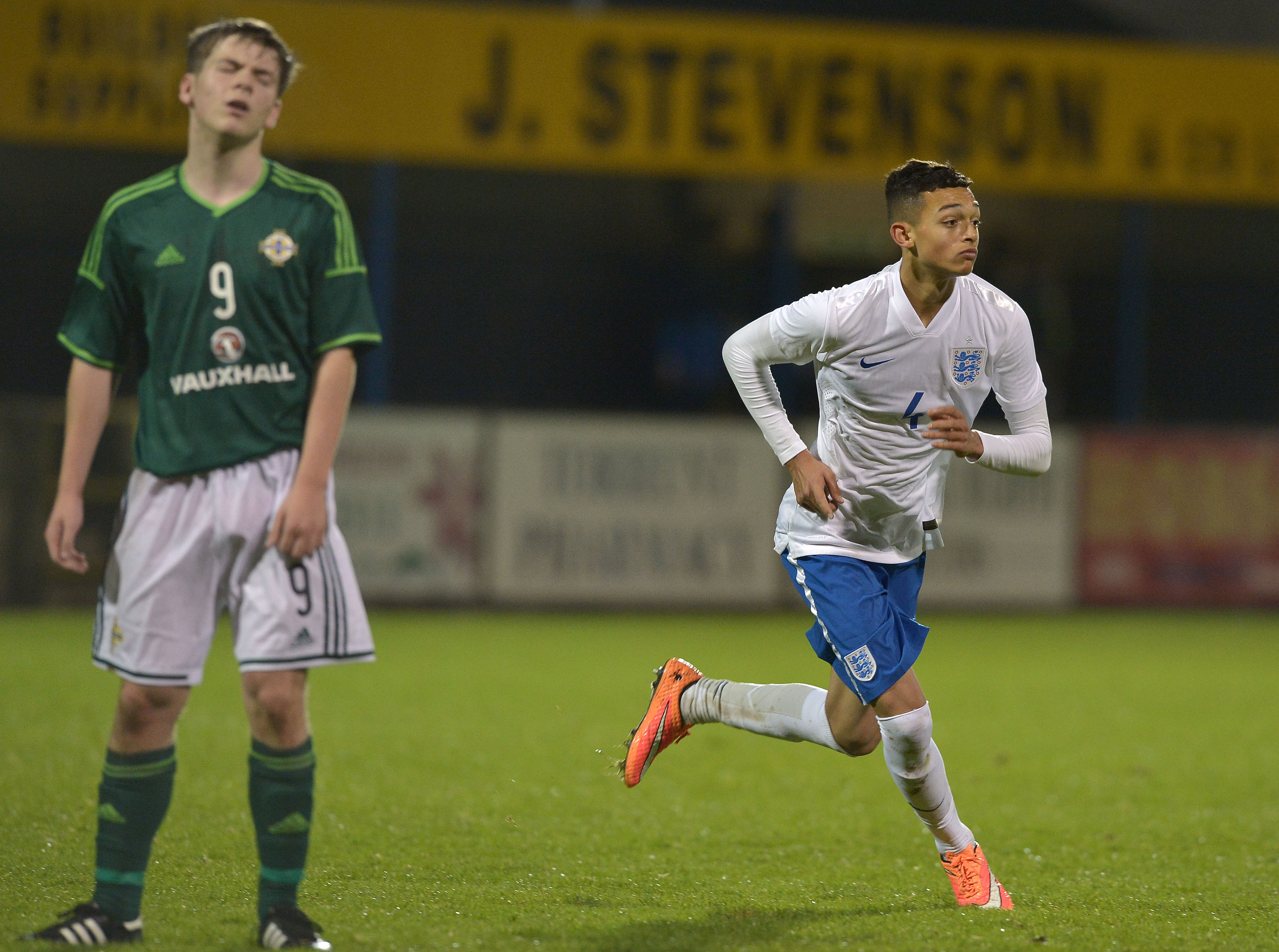 DUNGANNON, NORTHERN IRELAND - NOVEMBER 07: Andre Dozzell of England (R) celebrates scoring the opening goal during this evenings Sky Sports Victory Shield U16 international game between Northern Ireland and England at Stangmore Park on November 7, 2014 in Dungannon, Northern Ireland. (Photo by Charles McQuillan/Getty Images)