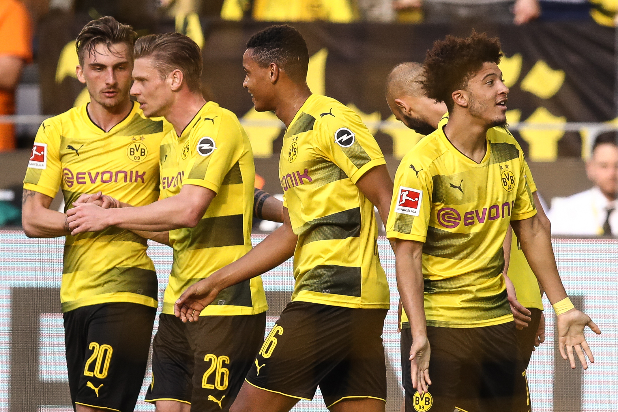 DORTMUND, GERMANY - APRIL 21: Jadon Sancho #7 of Borussia Dortmund celebrates with his team-mates after scoring a goal to make it 1-0 during the Bundesliga match between Borussia Dortmund and Bayer 04 Leverkusen at Signal Iduna Park on April 21, 2018 in Dortmund, Germany. (Photo by Maja Hitij/Bongarts/Getty Images)