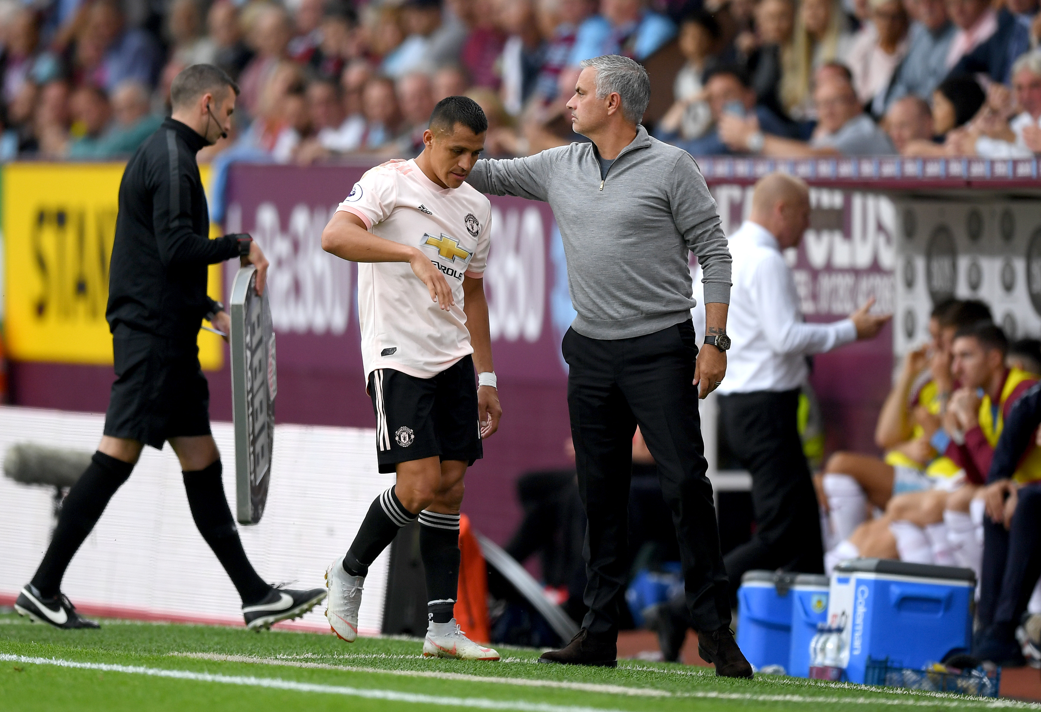 BURNLEY, ENGLAND - SEPTEMBER 02: Alexis Sanchez of Manchester United walks past Jose Mourinho, Manager of Manchester United as he is substituted during the Premier League match between Burnley FC and Manchester United at Turf Moor on September 2, 2018 in Burnley, United Kingdom. (Photo by Shaun Botterill/Getty Images)