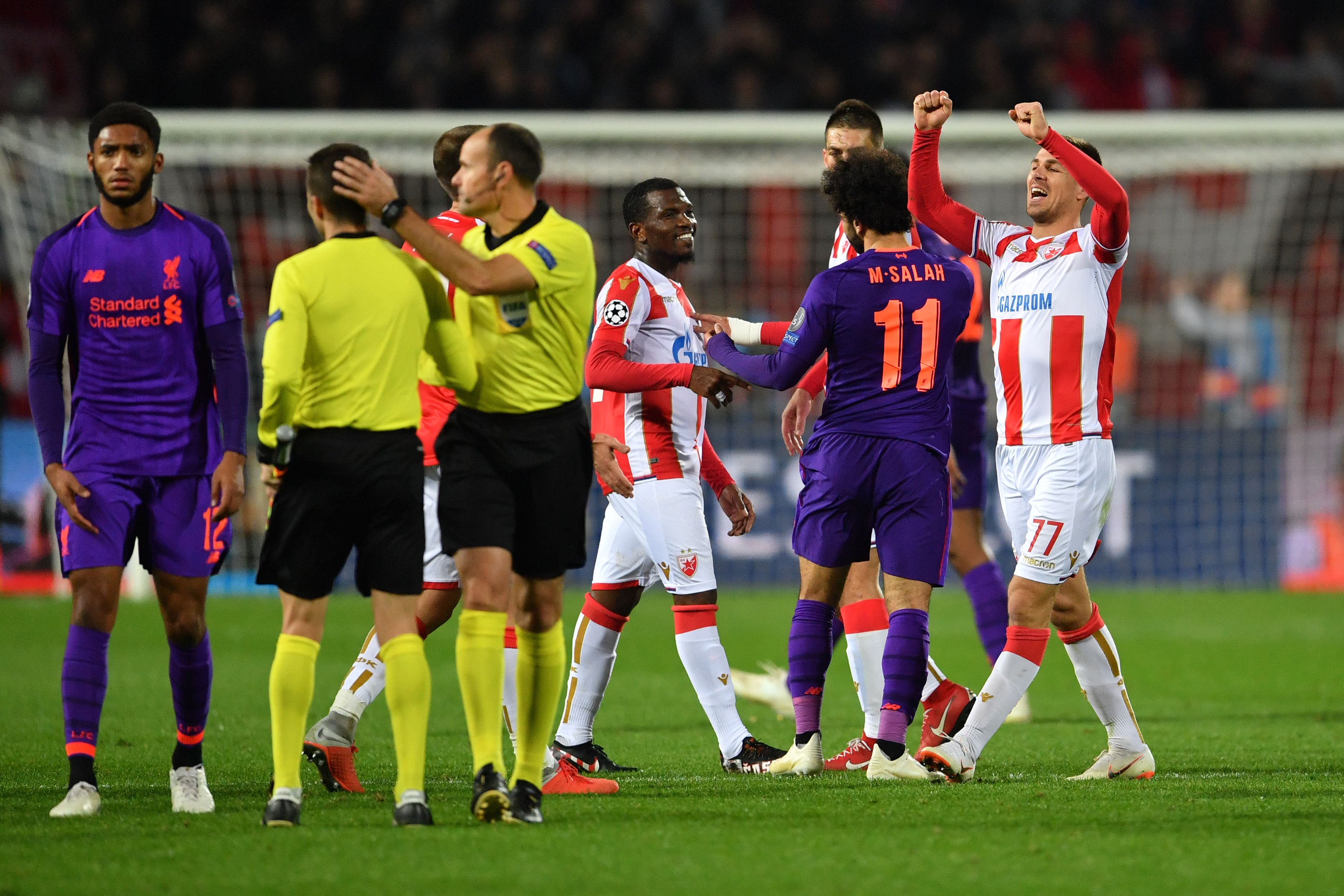 Red Star Belgrade's players and Liverpool's players react after the UEFA Champions League Group C second-leg football match between Red Star Belgrade and Liverpool FC at the Rajko Mitic Stadium in Belgrade on November 6, 2018. (Photo by Andrej ISAKOVIC / AFP) (Photo credit should read ANDREJ ISAKOVIC/AFP/Getty Images)