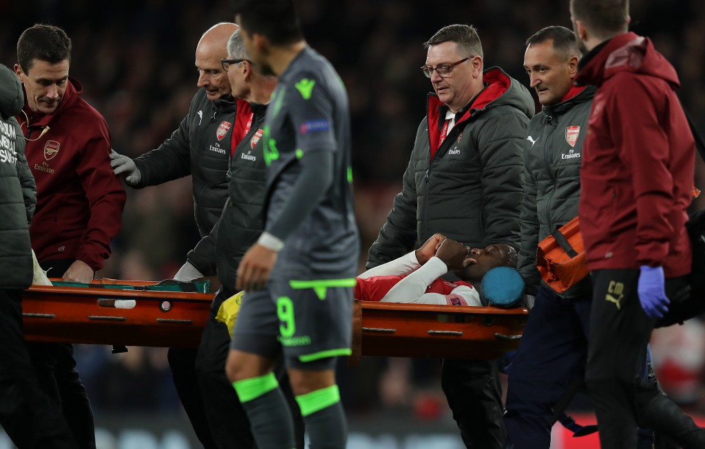 Unlucky Welbeck stretchered off the field (Photo by Richard Heathcote/Getty Images)