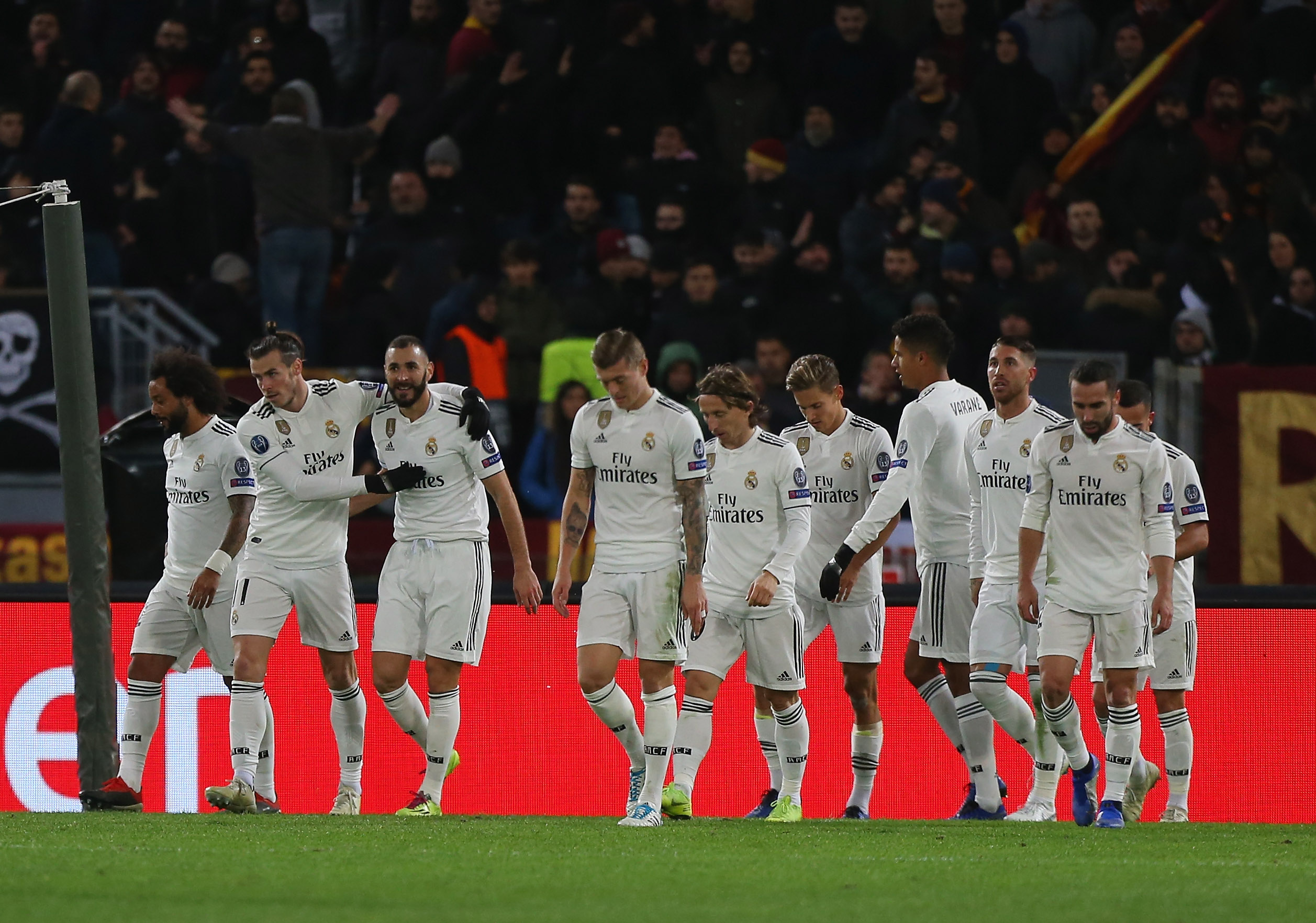 ROME, ITALY - NOVEMBER 27: Lucas Vazquez with his teammates of Real Madrid celebrates after scoring the team's second goal during the group G match of the UEFA Champions League between AS Roma and Real Madrid at Stadio Olimpico on November 27, 2018 in Rome, Italy. (Photo by Paolo Bruno/Getty Images)