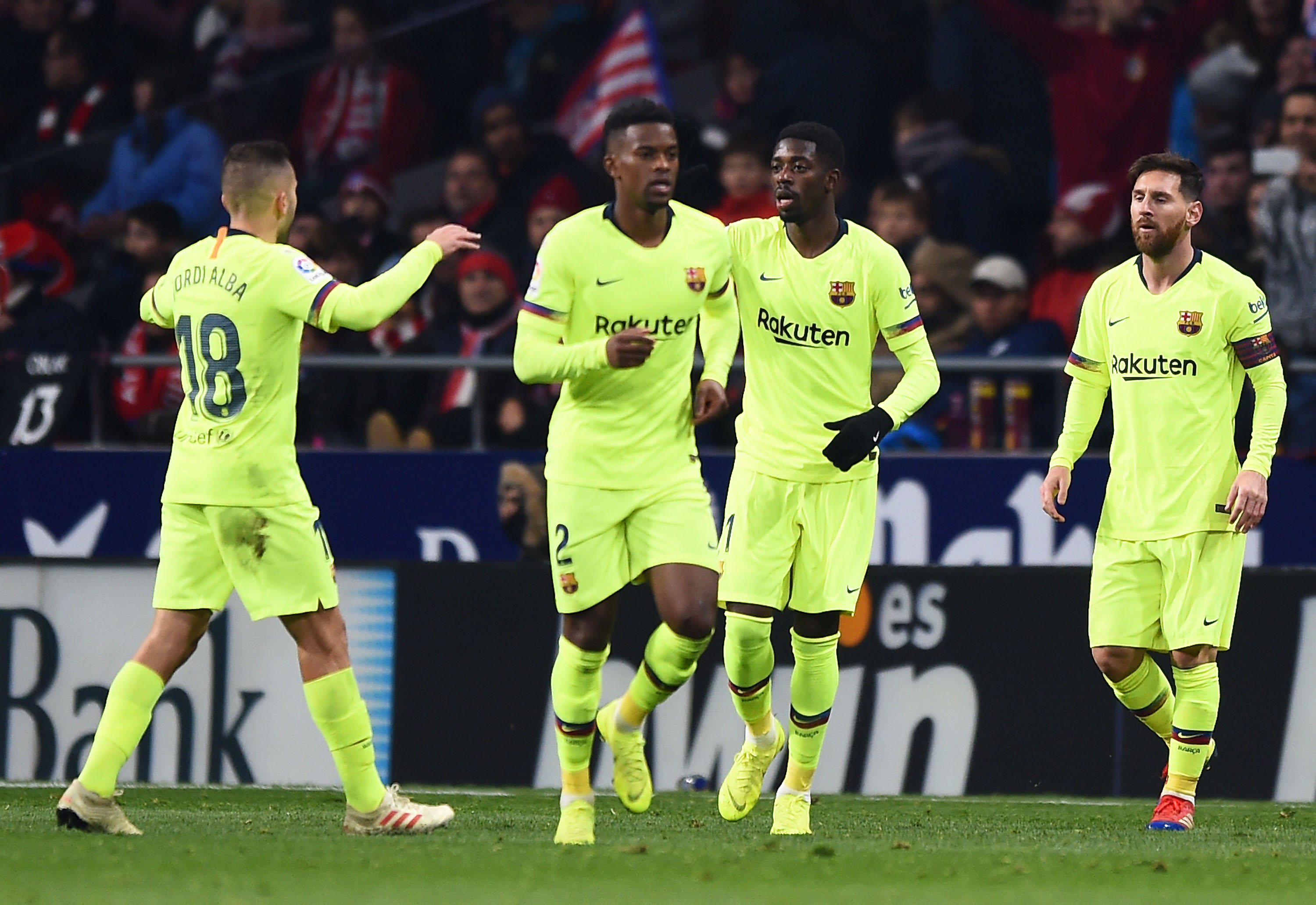 MADRID, SPAIN - NOVEMBER 24: Ousmane Dembele of Barcelona (2R) celebrates after scoring his team's first goal with Jordi Alba and Lionel Messi during the La Liga match between Club Atletico de Madrid and FC Barcelona at Wanda Metropolitano on November 24, 2018 in Madrid, Spain. (Photo by Denis Doyle/Getty Images)