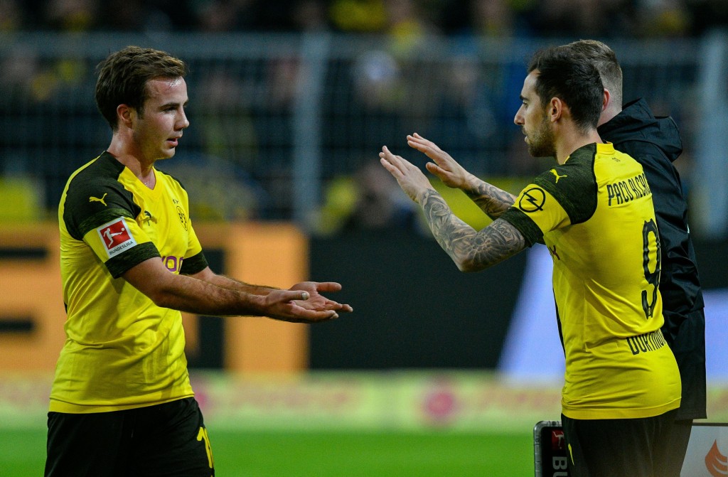 Dortmund's midfielder Mario Goetze and Dortmund's midfielder Alcacer Paco celebrate after scoring during the German first division Bundesliga football match between Borussia Dortmund and SC Freiburg in Dortmund, western Germany on December 1, 2018. (Photo by SASCHA SCHUERMANN / AFP) / RESTRICTIONS: DFL REGULATIONS PROHIBIT ANY USE OF PHOTOGRAPHS AS IMAGE SEQUENCES AND/OR QUASI-VIDEO (Photo credit should read SASCHA SCHUERMANN/AFP/Getty Images)