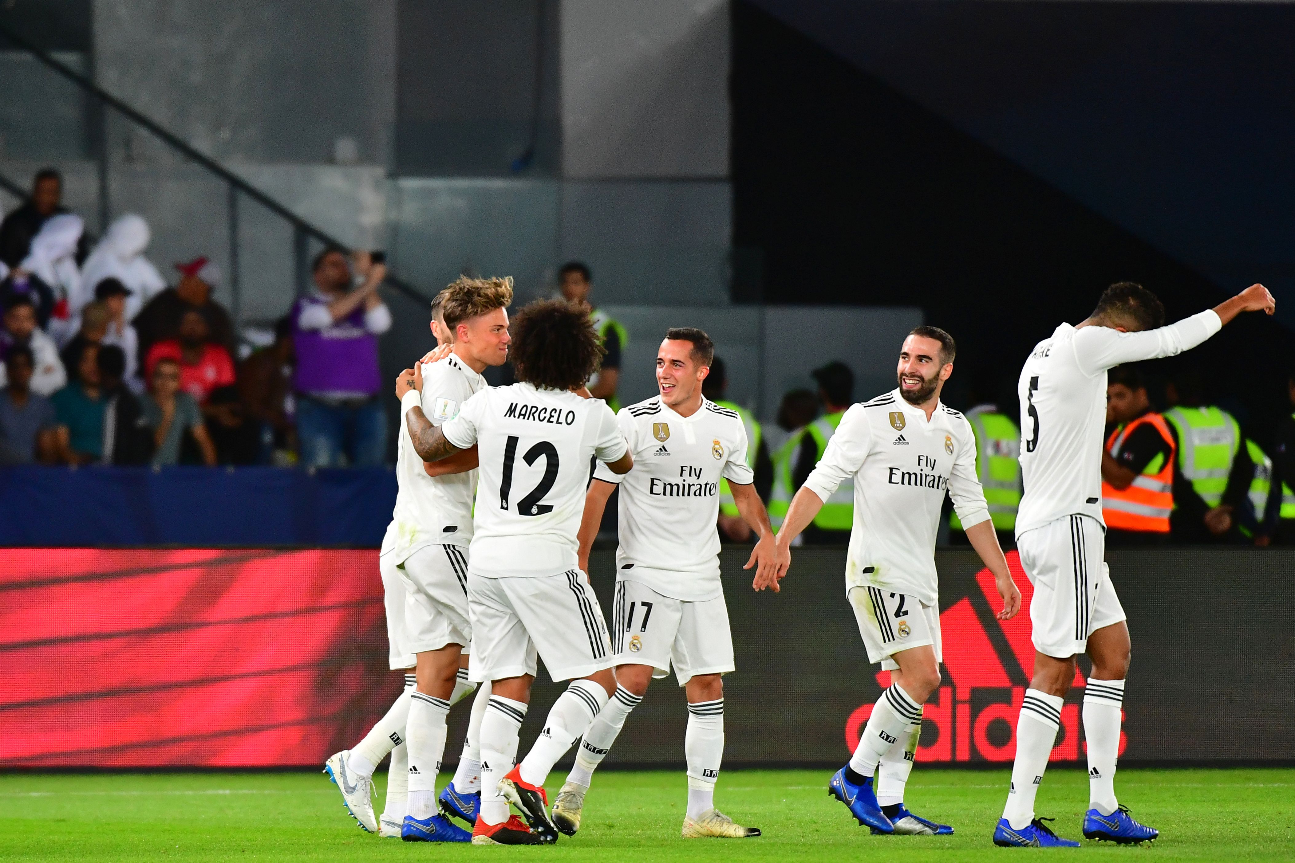 Real Madrid's Spanish midfielder Marcos Llorente (L) celebrates after scoring a goal during the FIFA Club World Cup final football match Spain's Real Madrid vs Abu Dhabi's Al Ain at the Zayed Sports City Stadium in Abu Dhabi, the capital of the United Arab Emirates, on December 22, 2018. (Photo by Giuseppe CACACE / AFP) (Photo credit should read GIUSEPPE CACACE/AFP/Getty Images)